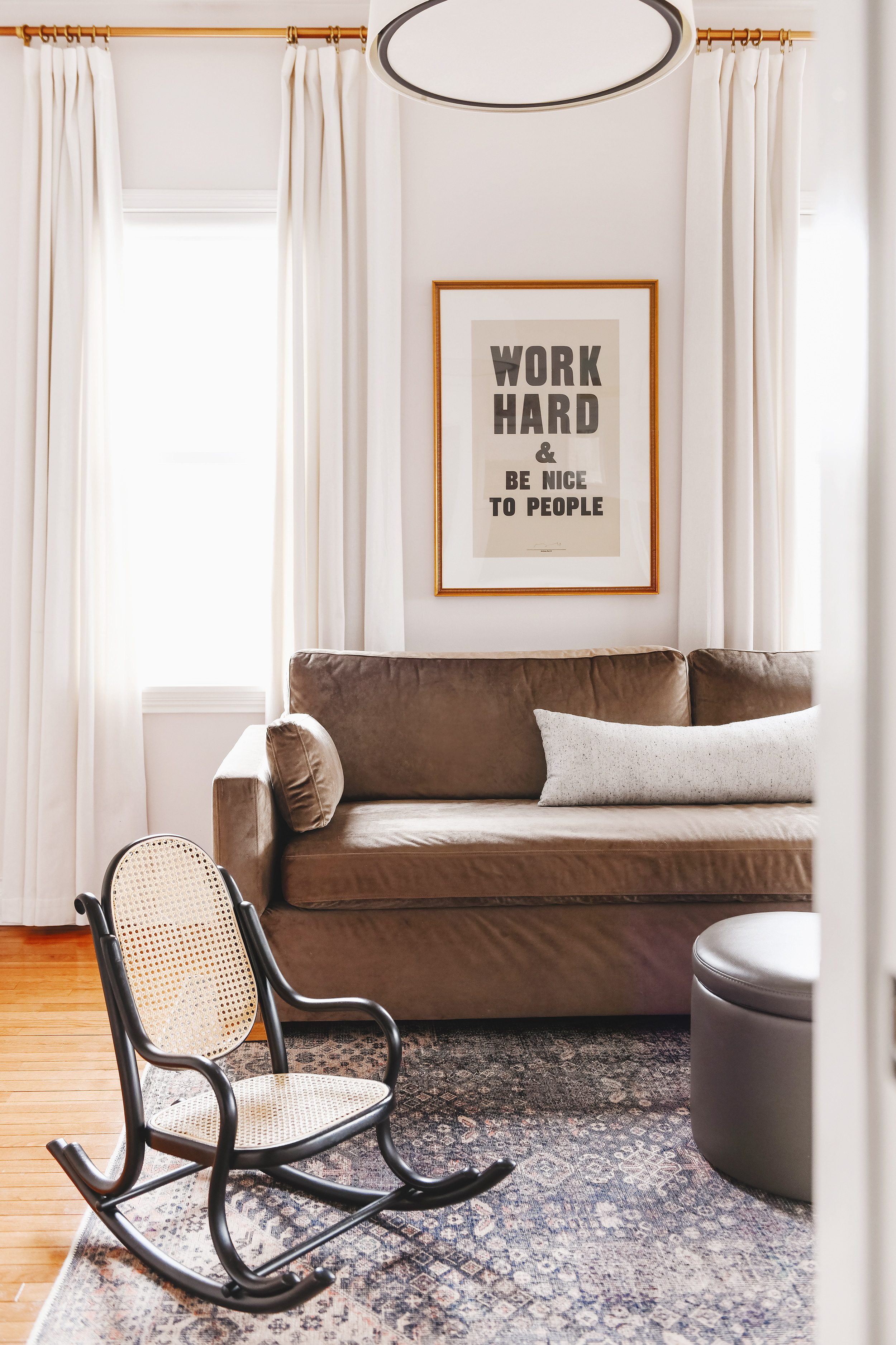 A view into our family room with an art print that says 'Work Hard & Be Nice to People' | via Yellow Brick Home, a family room and play room reveal!