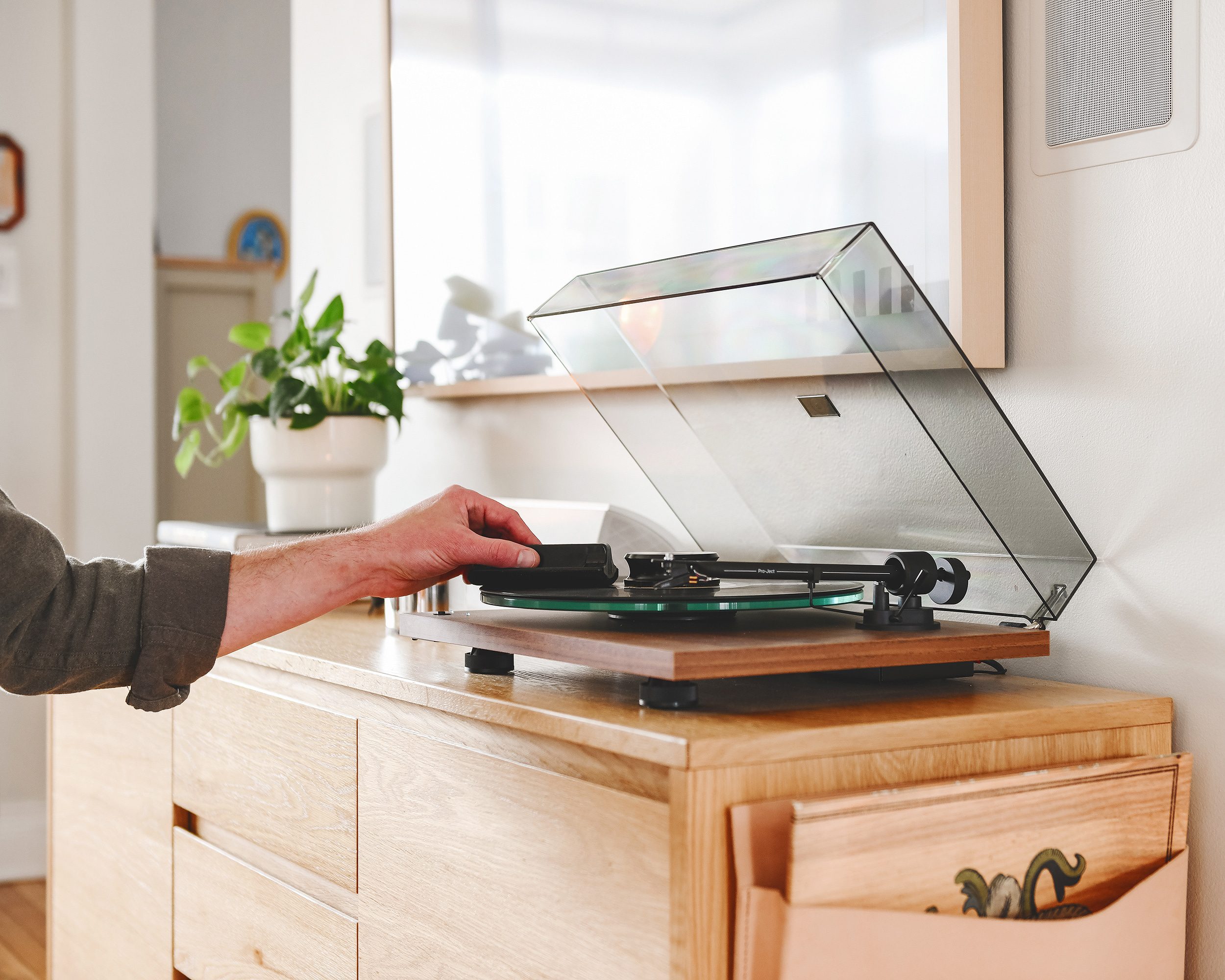 Scott cleans a record prior to dropping the needle on Arcade Fire's classic album, Funeral // via Yellow Brick Home
