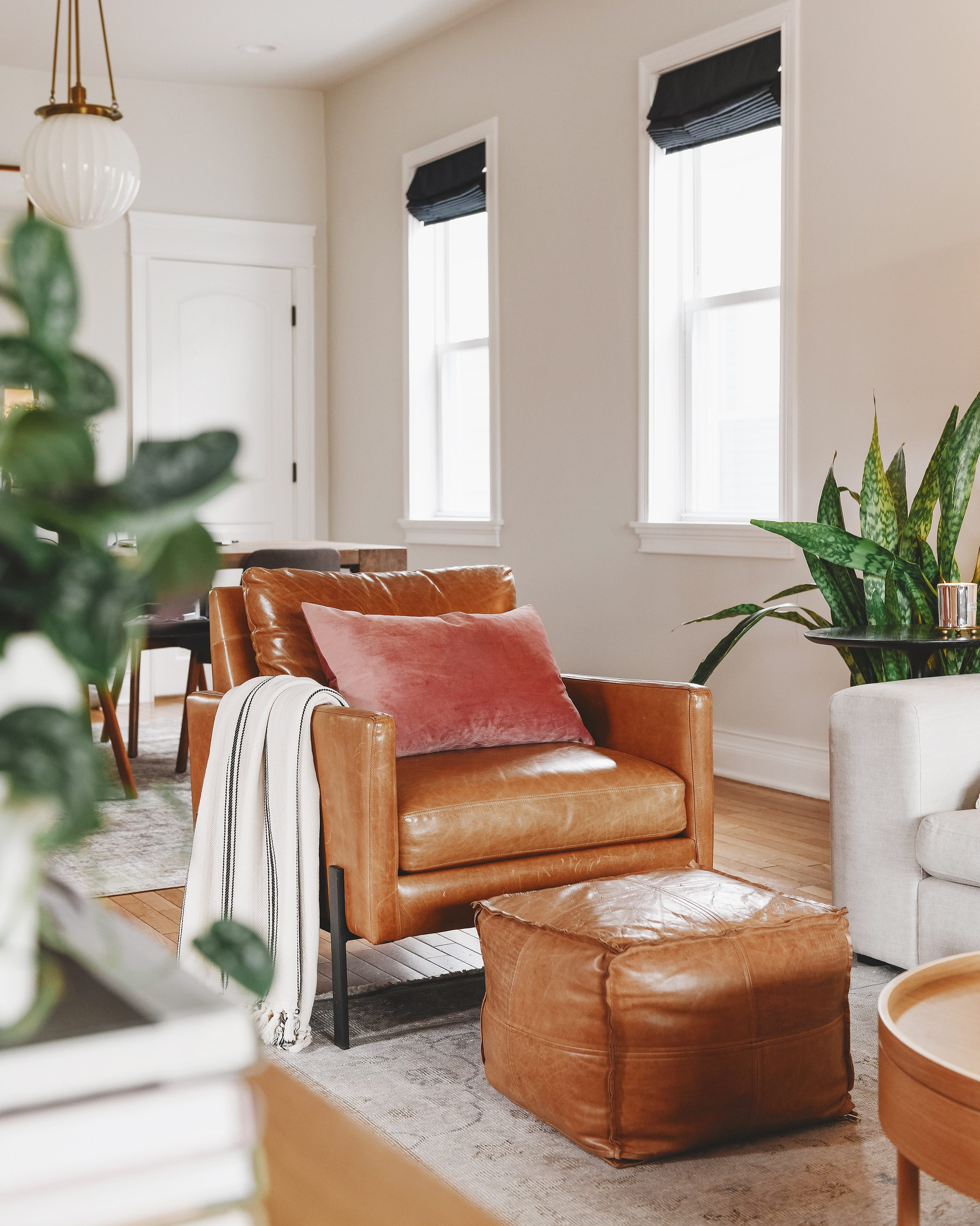 The leather chair in our Chicago living room that inspired the roundup // via Yellow Brick Home
