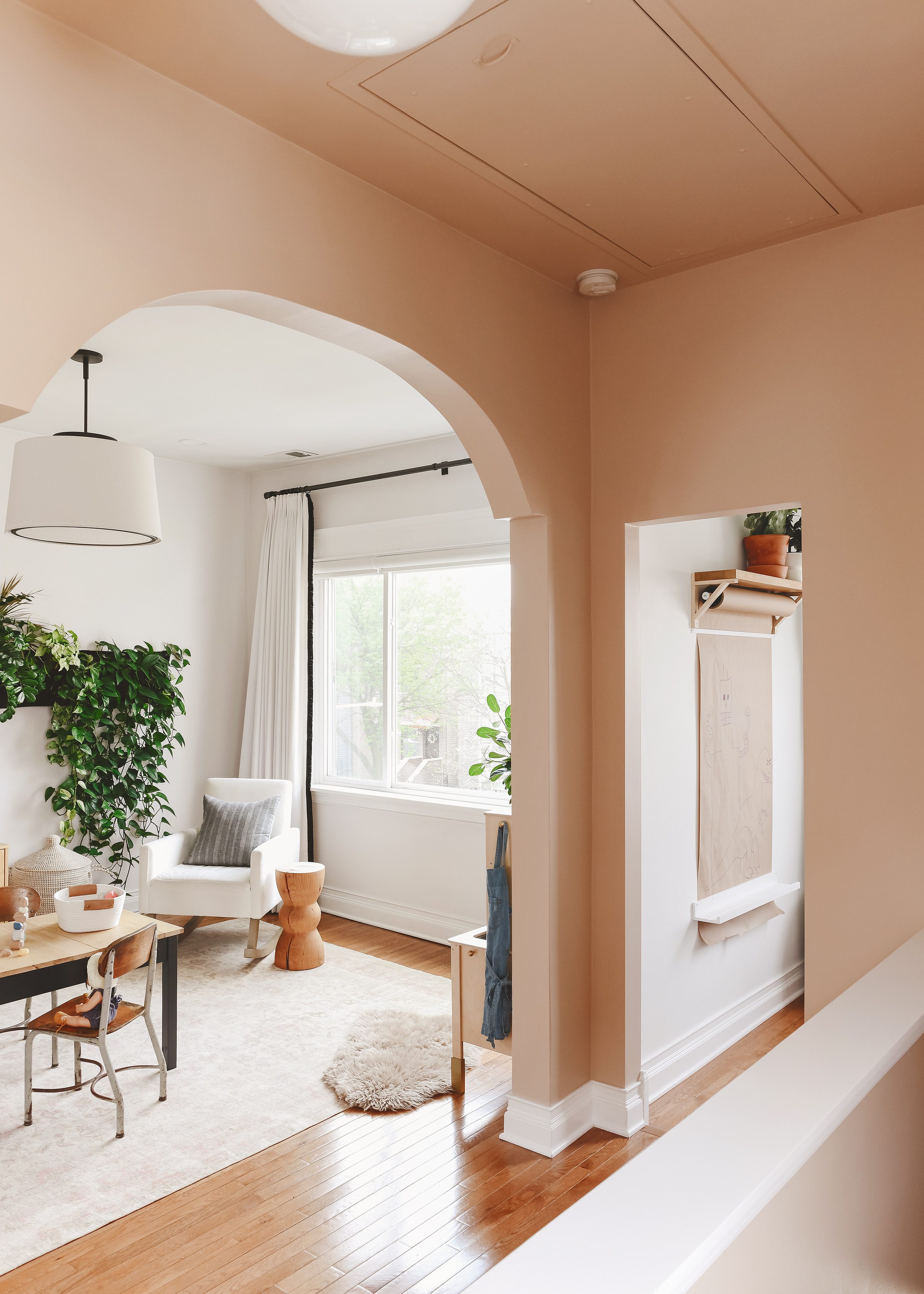 Look at that arch! Hall color is painted Valspar Milk Toast | via Yellow Brick Home