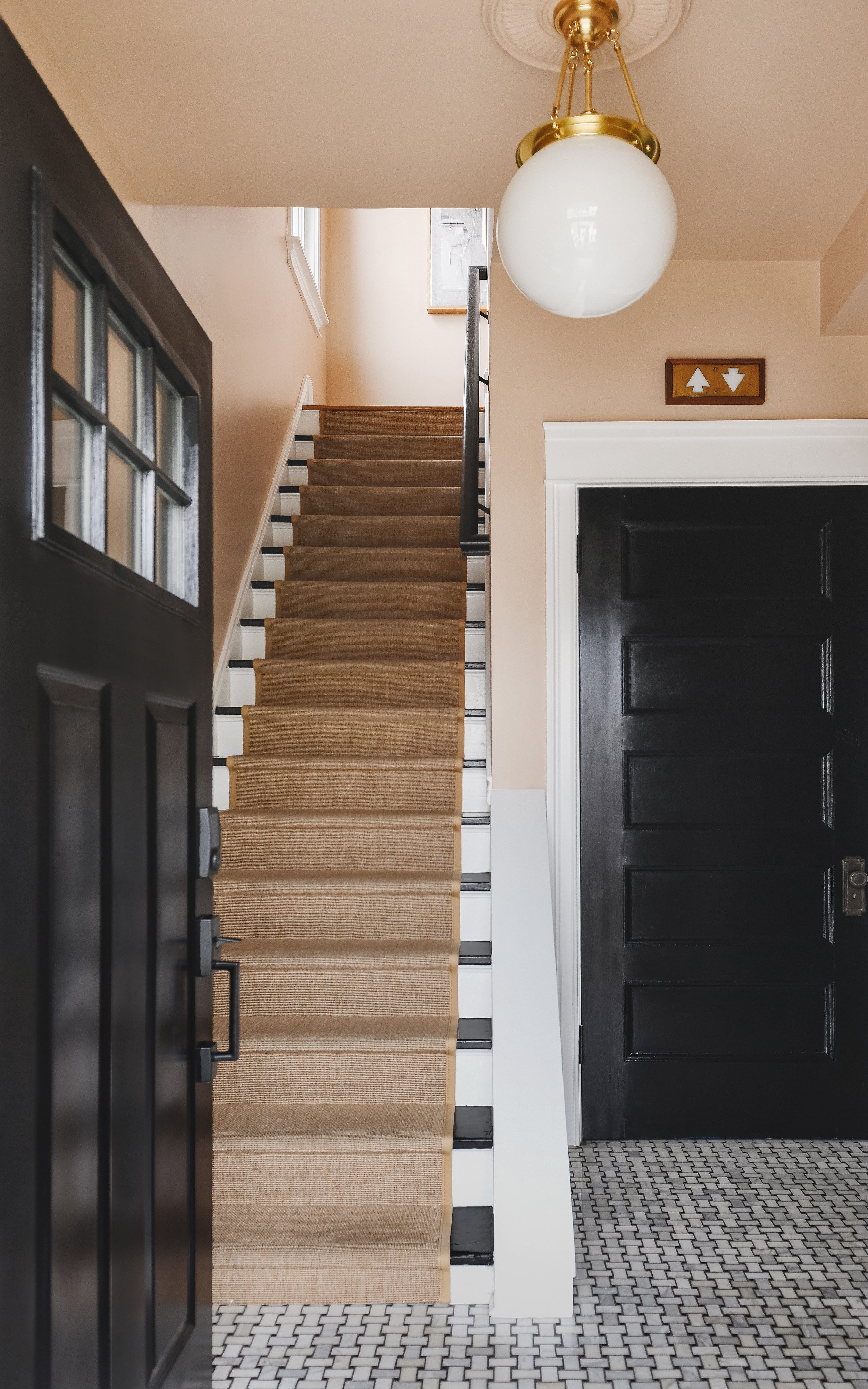Our entryway, black, white, peach and neutral! | How to Install a Stair Runner in 10 Steps via Yellow Brick Home