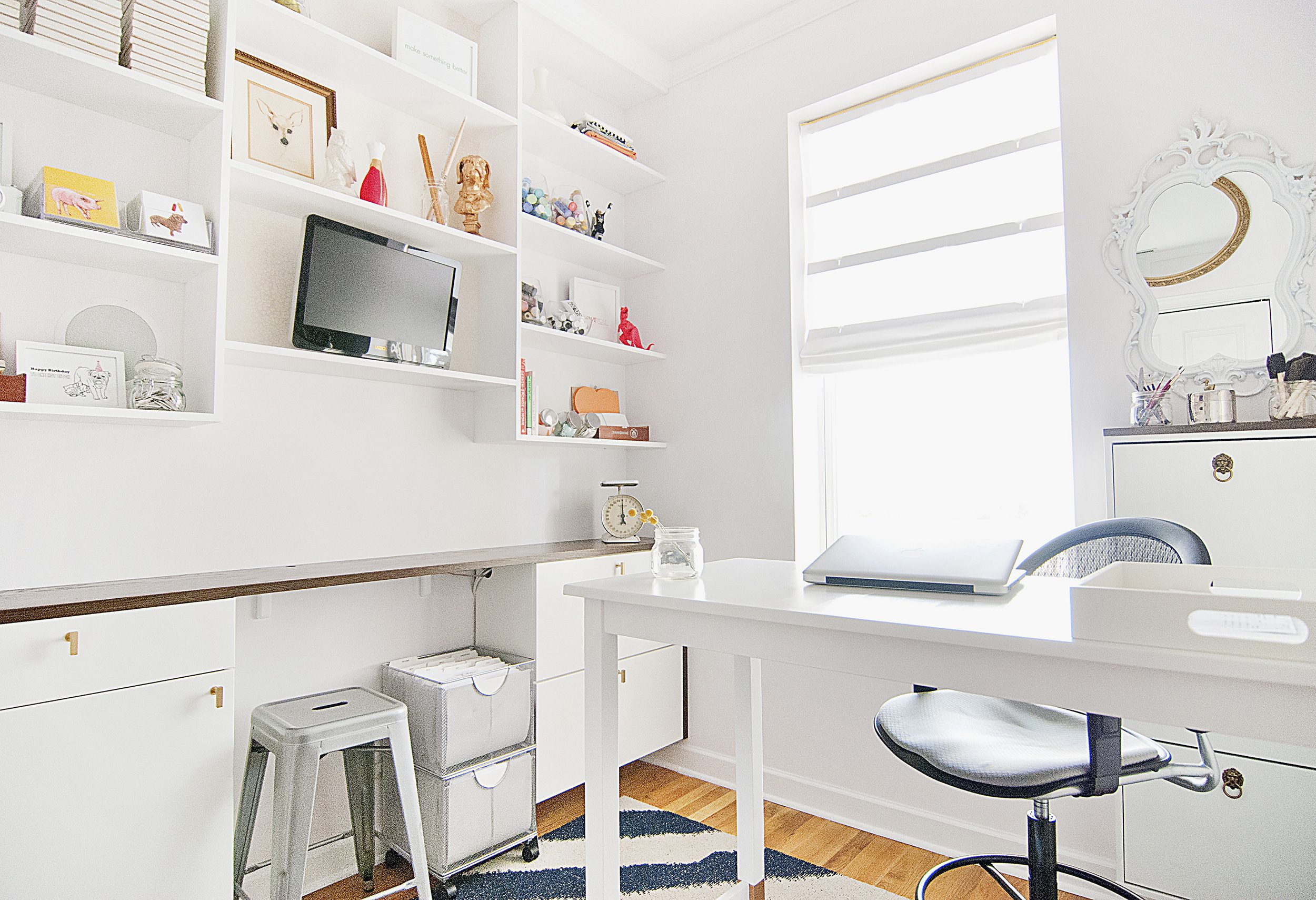 bright and airy home office with built-in wall storage and desk | via Yellow Brick Home