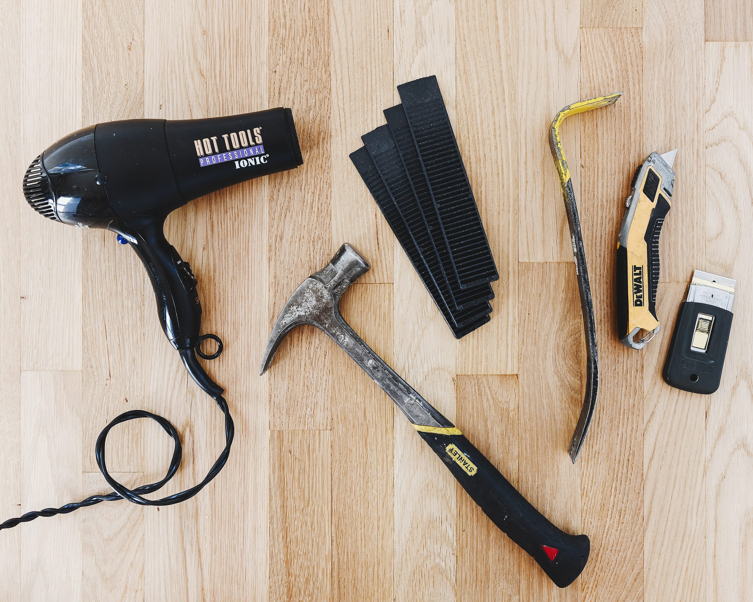The tools required to remove a vanity backsplash from a granite countertop. 