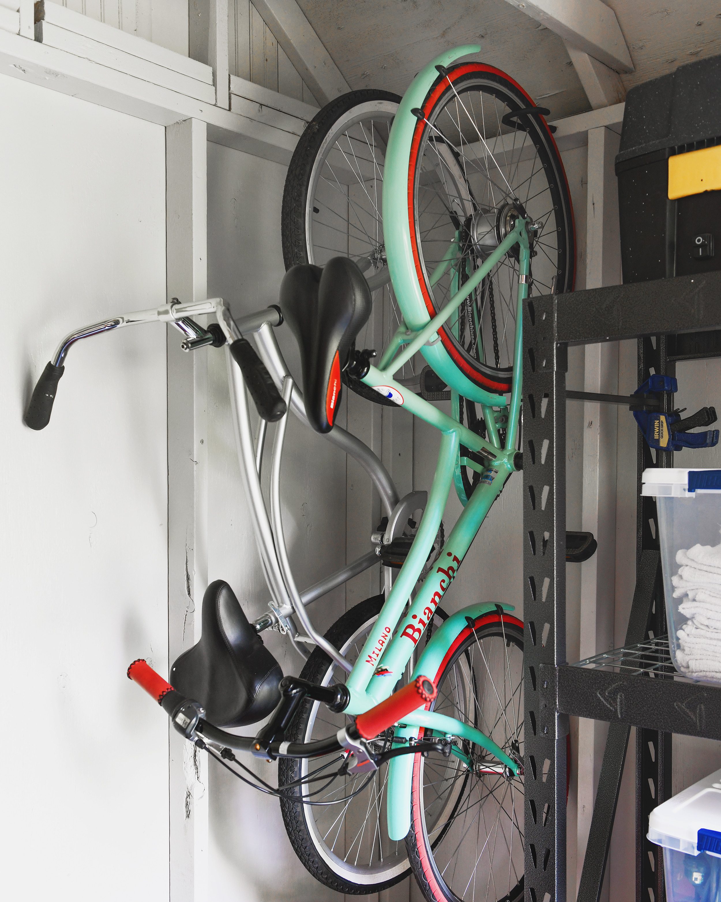 Hang your bikes vertically from a strong wall | via Yellow Brick Home