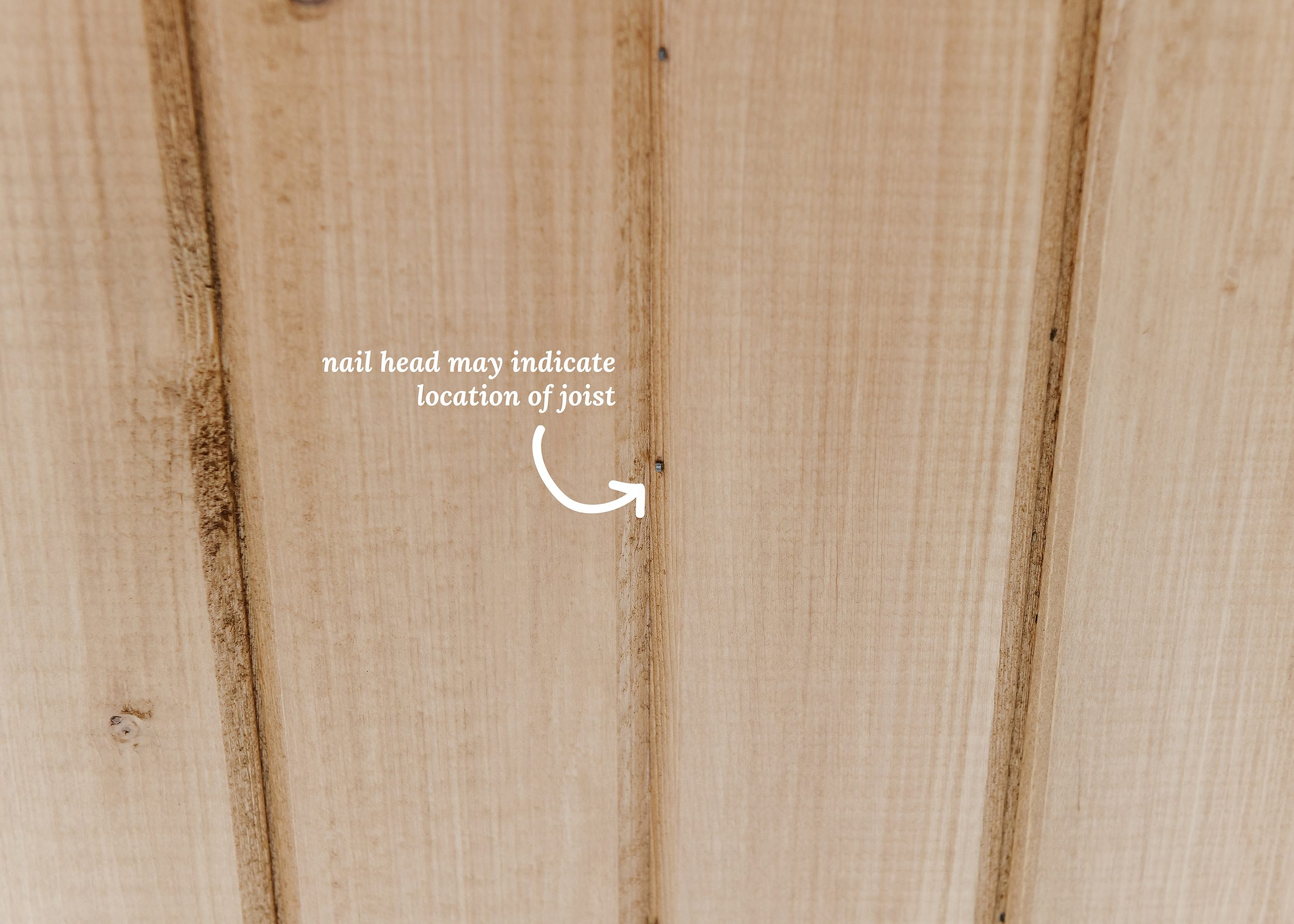 A graphic photo shows how locating a small finish nail can reveal the location of a hidden ceiling joist. 