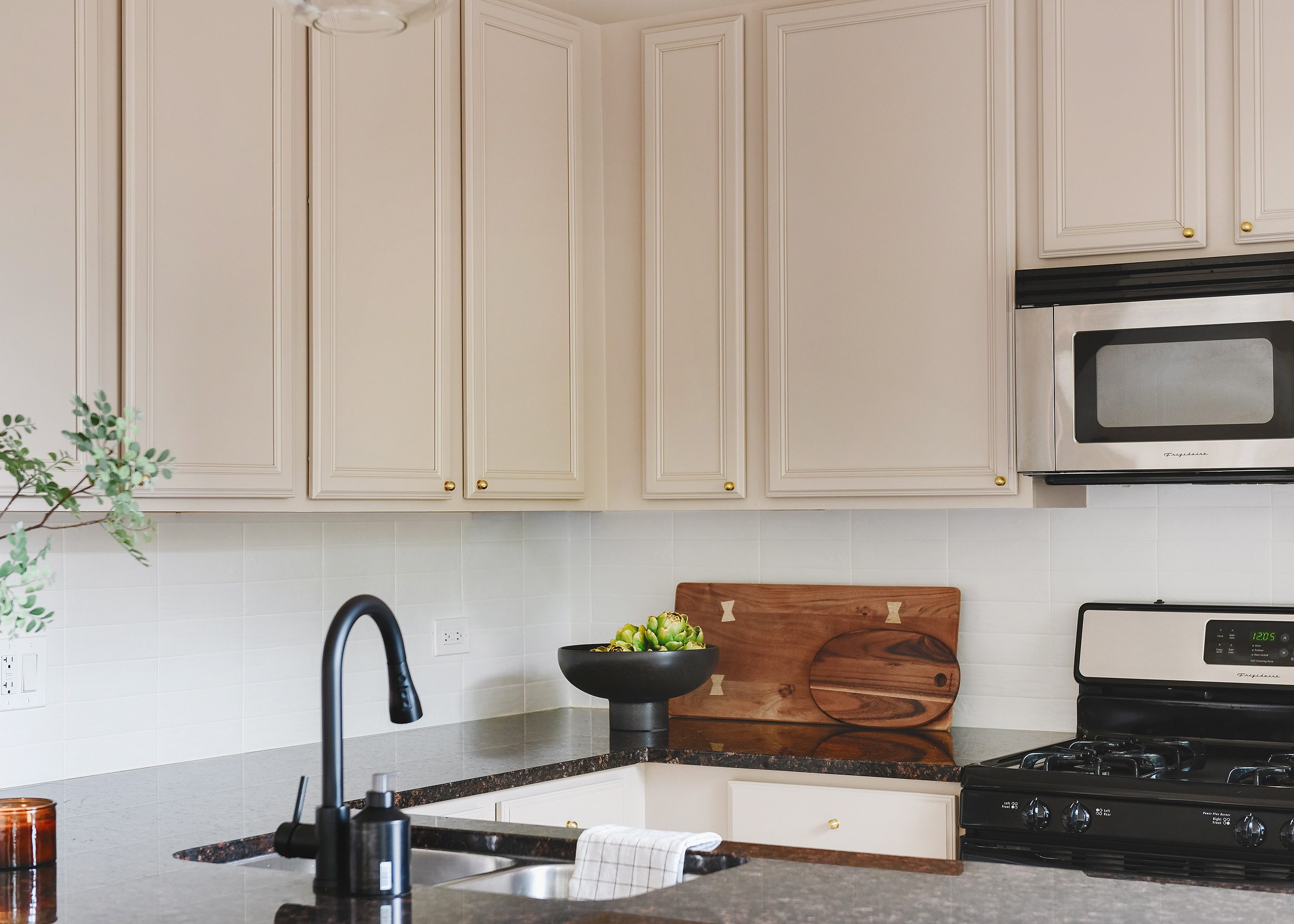 Valspar Lamb's Ear is the perfect neutral tone to compliment the existing granite countertops.