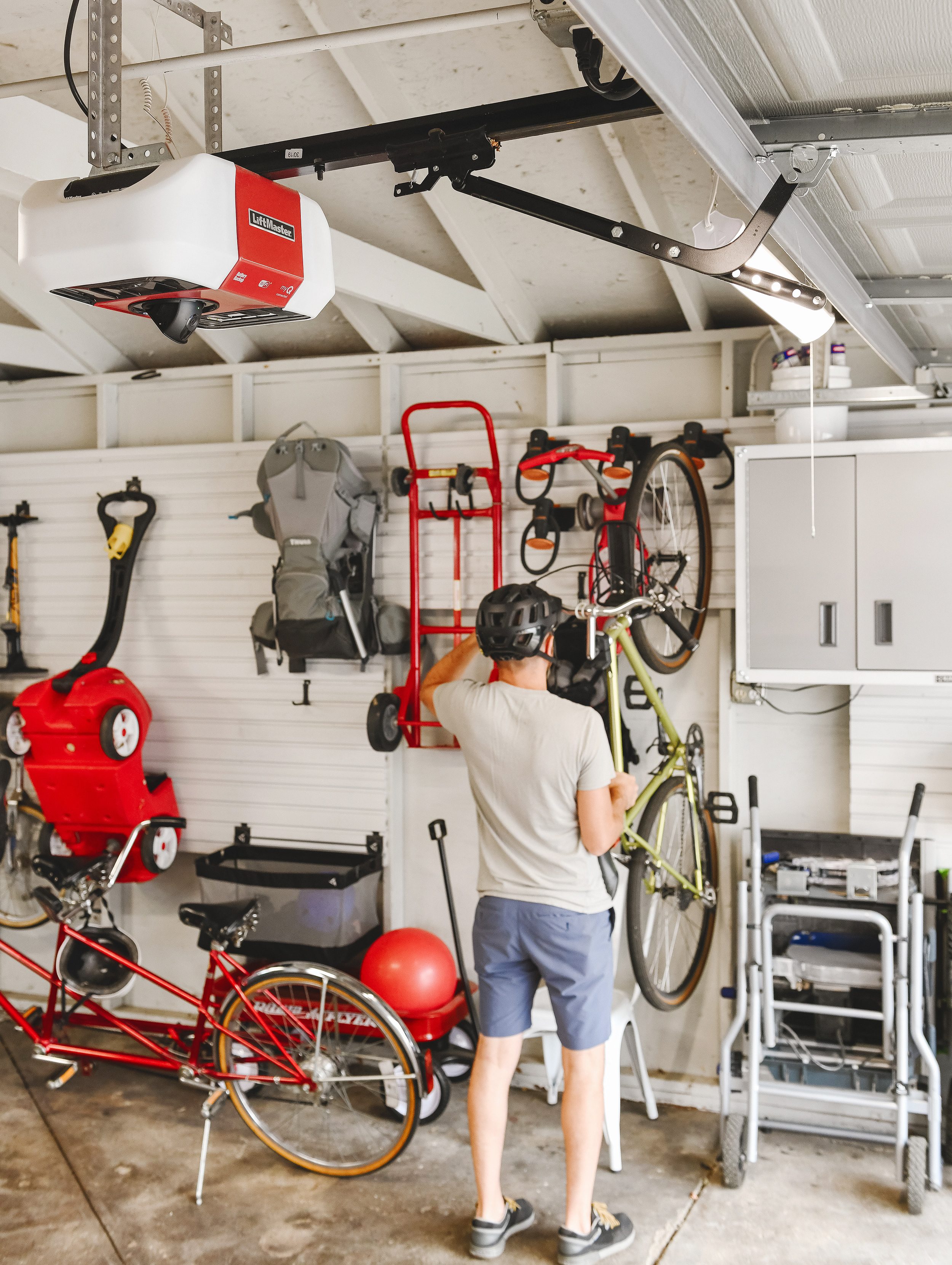 Scott hangs up his bike after accessing the garage with the myQ app. 