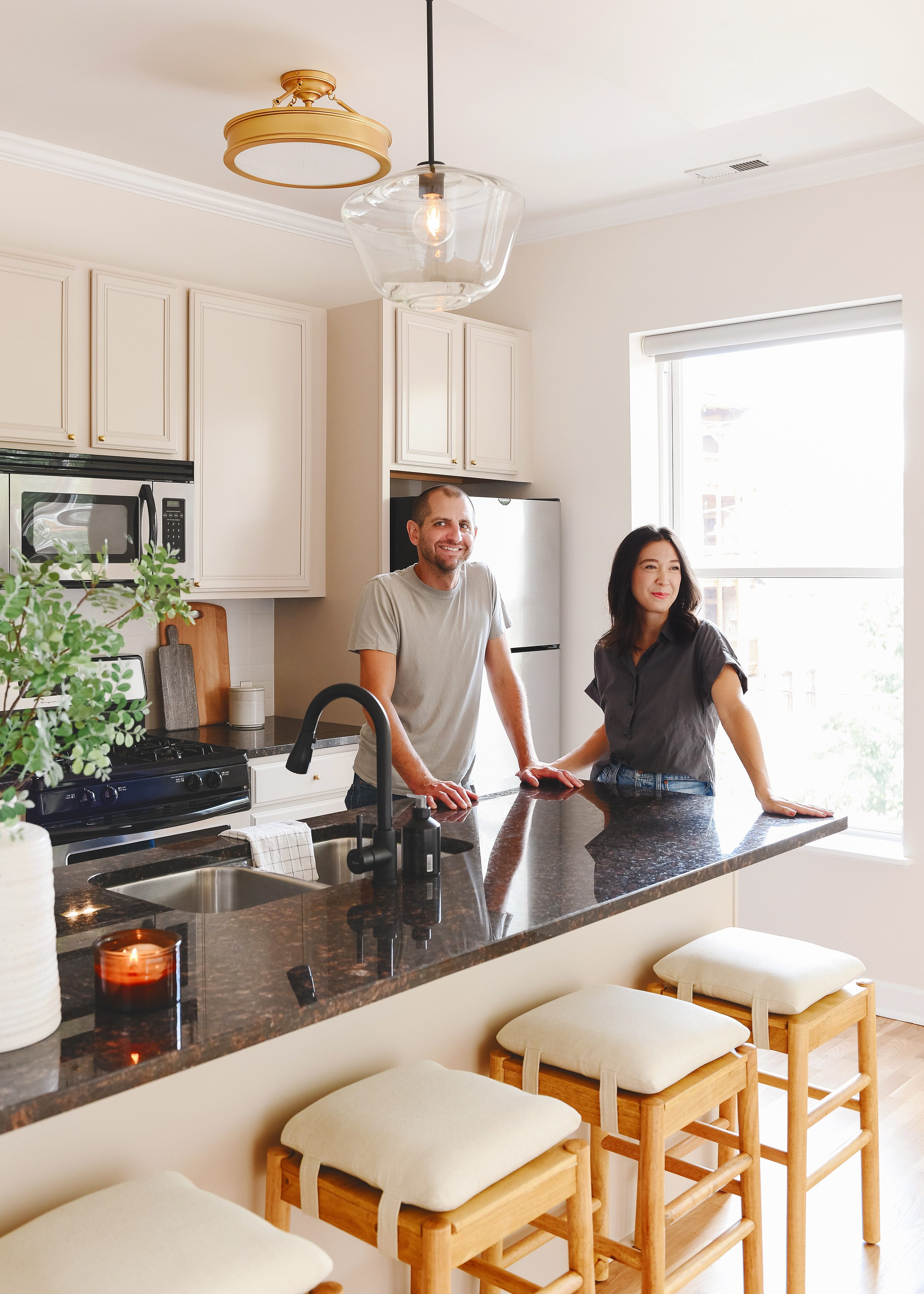 Kim and Scott in the kitchen they made over! via Yellow Brick Home