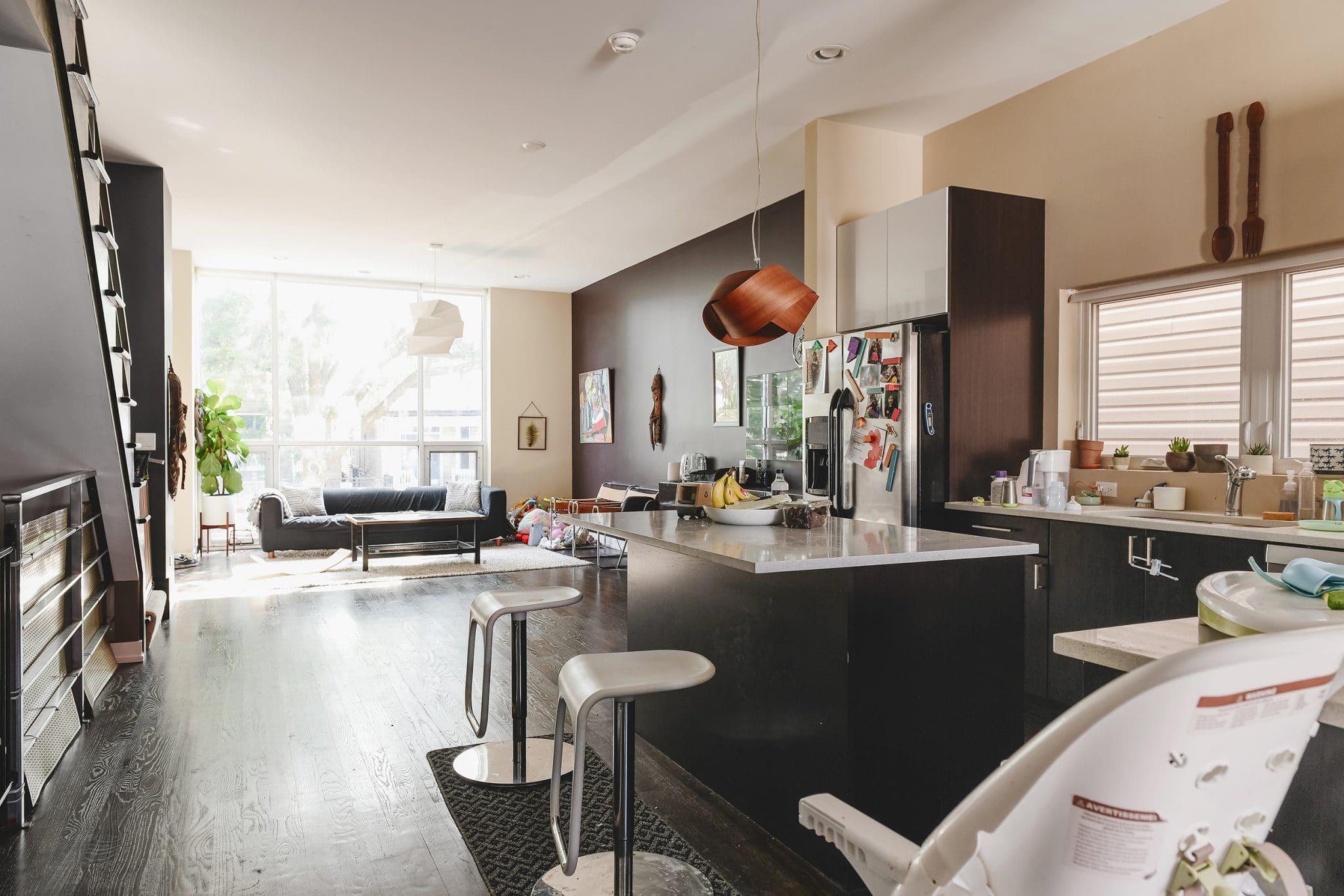Dark and moody open floor plan, kitchen in center, gets an upgrade! | via Yellow Brick Home