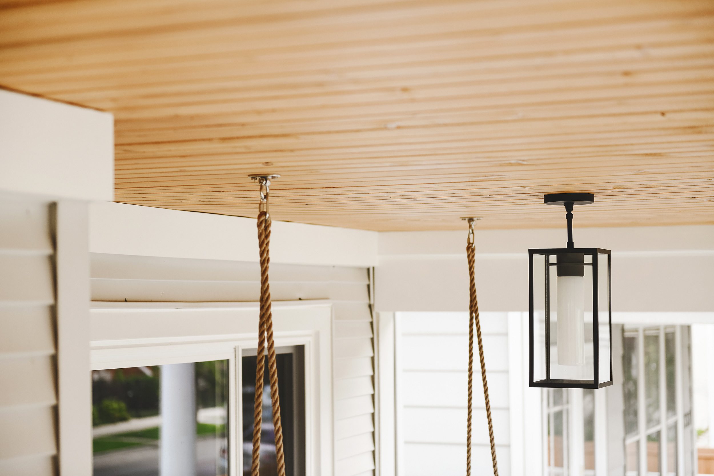 A detail photo of the new porch ceiling and fresh pendant light. 