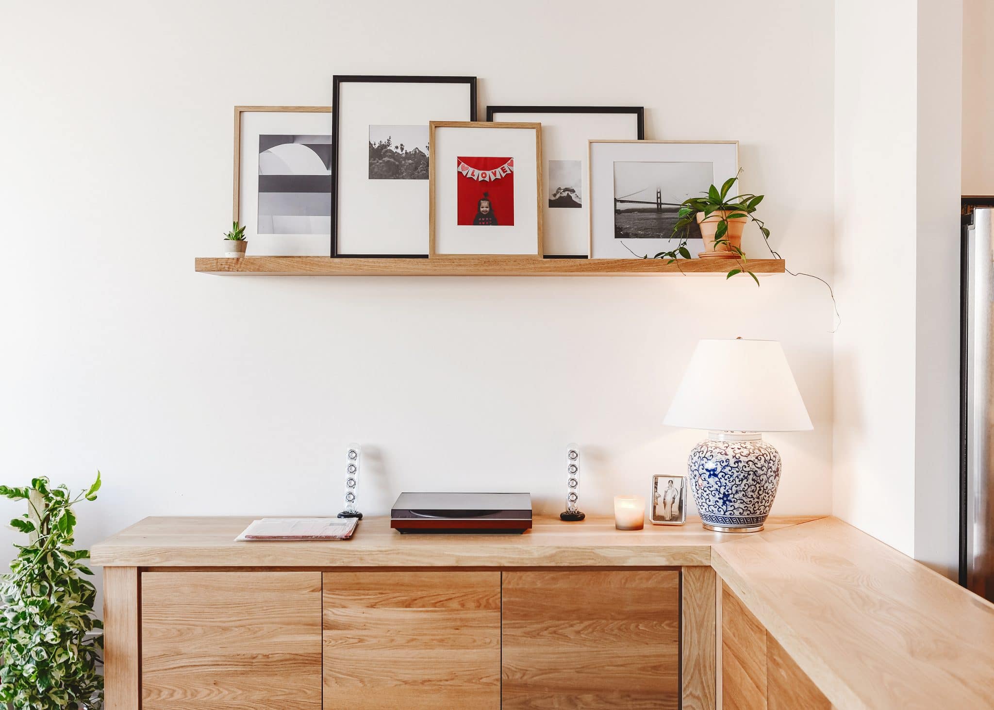 L-shaped sideboard with floating shelf above, white oak and neutral colors | play nook inspiration in an open concept home | via Yellow Brick Home