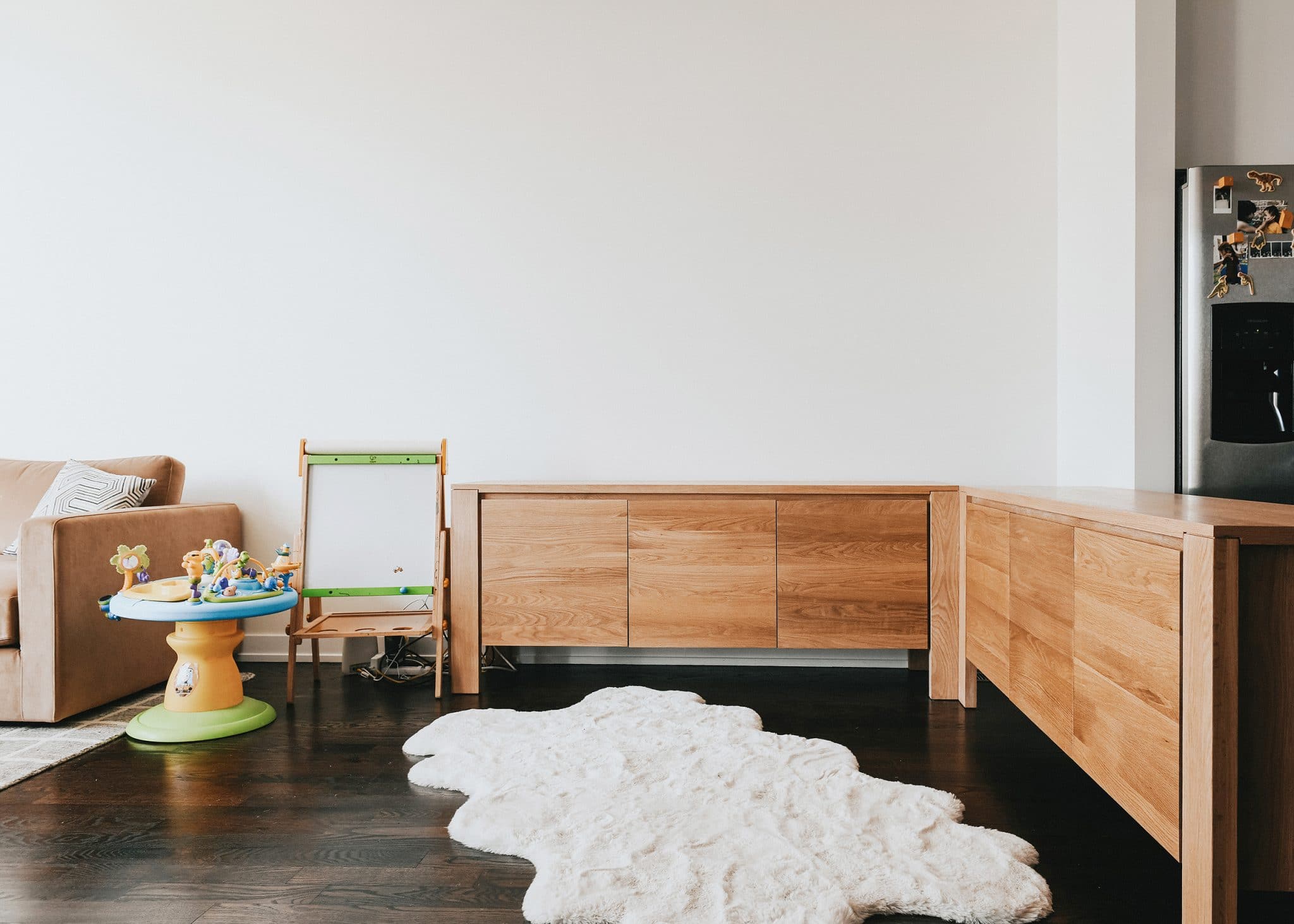 joining two sideboards together to create an L-shape | play nook inspiration in an open concept home | via Yellow Brick Home
