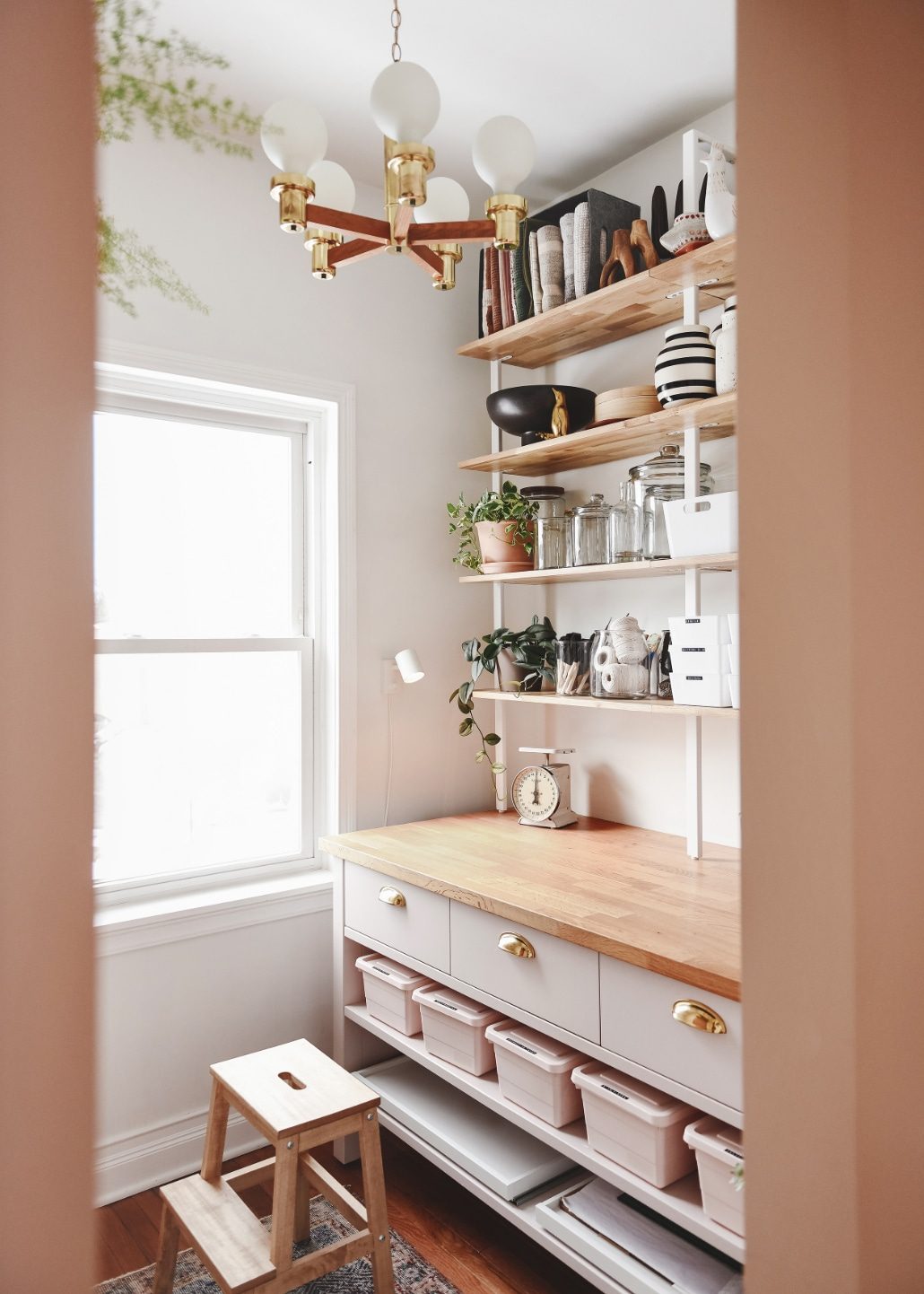 The EQ3 ladder shelf system in our craft room // via Yellow Brick Home
