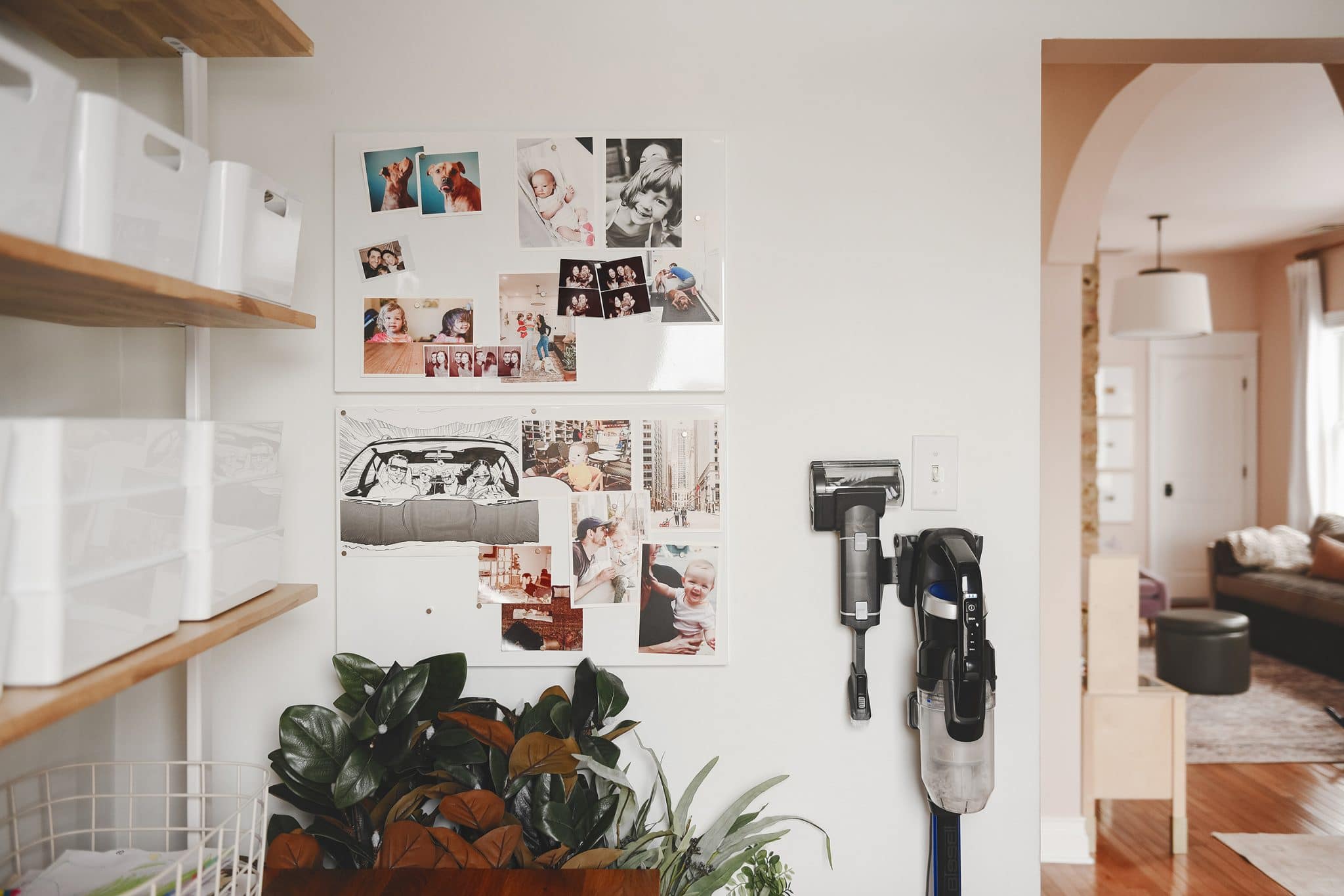The door wall holds our magnet photo boards and the cordless Bissell vacuum. 