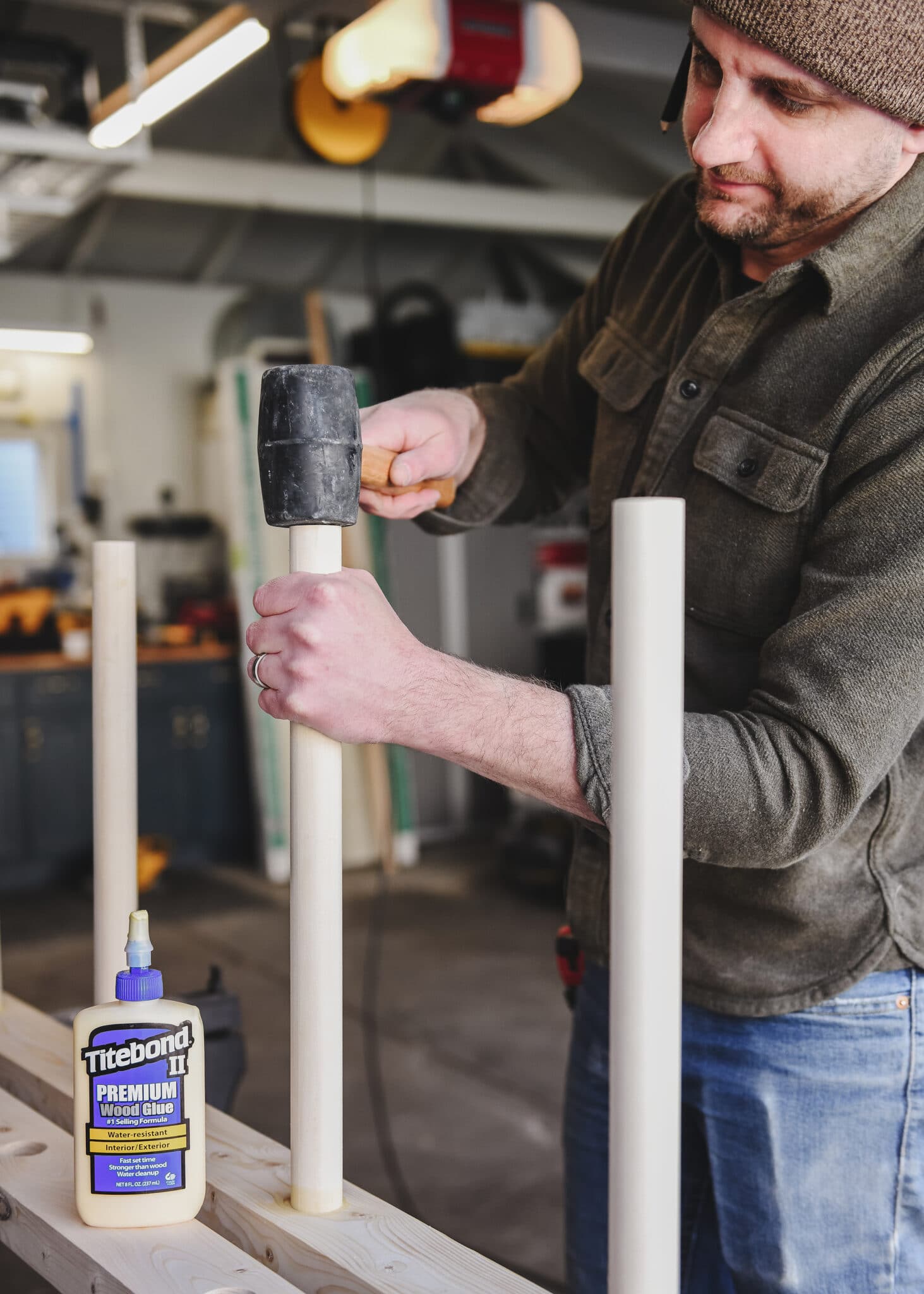 We tapped the rungs into place with a rubber mallet until they were flush with the 2x4 supports. via // yellowbrickhome