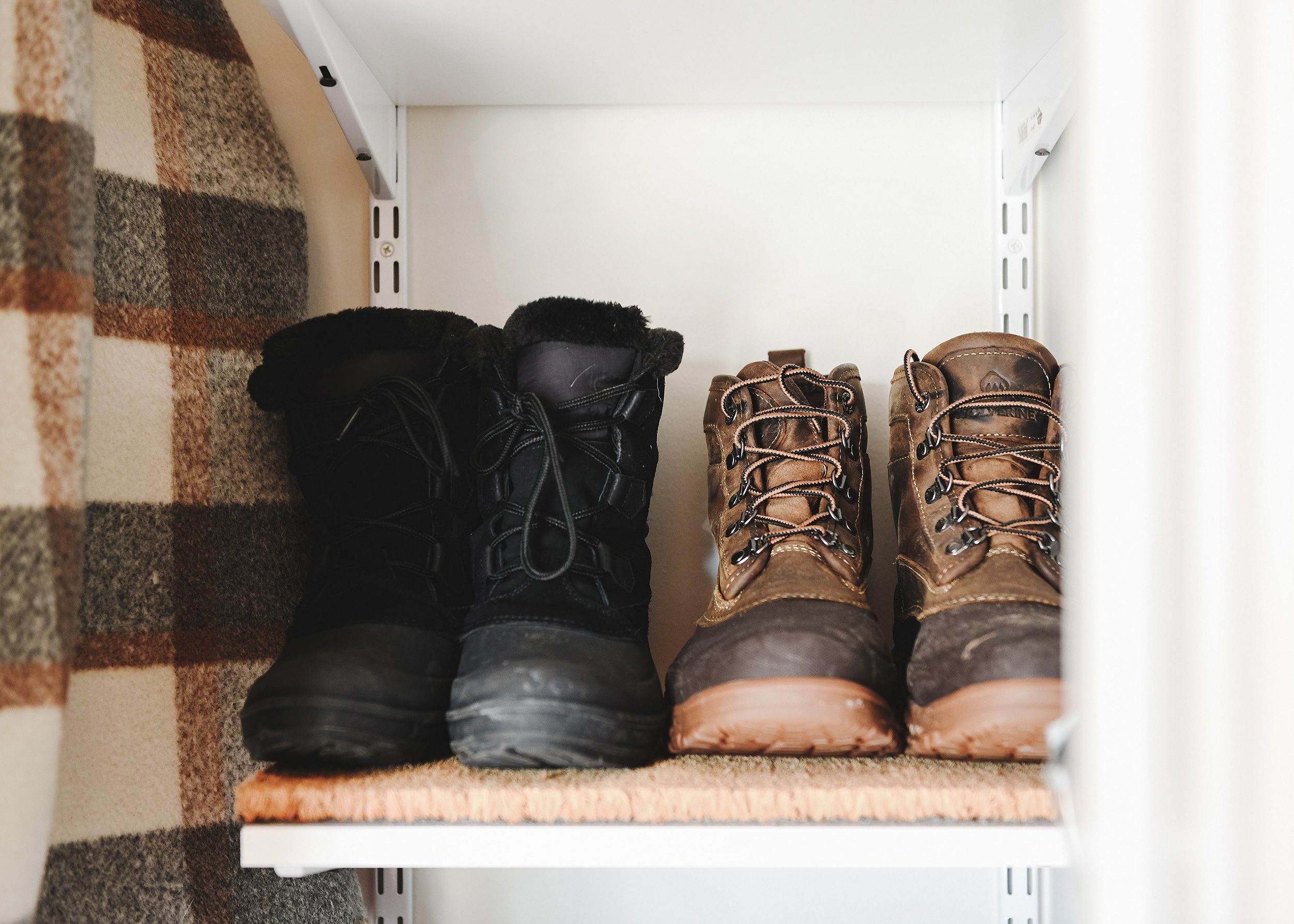 Coir mats on a vertical shelving column keep things clean and tidy. 