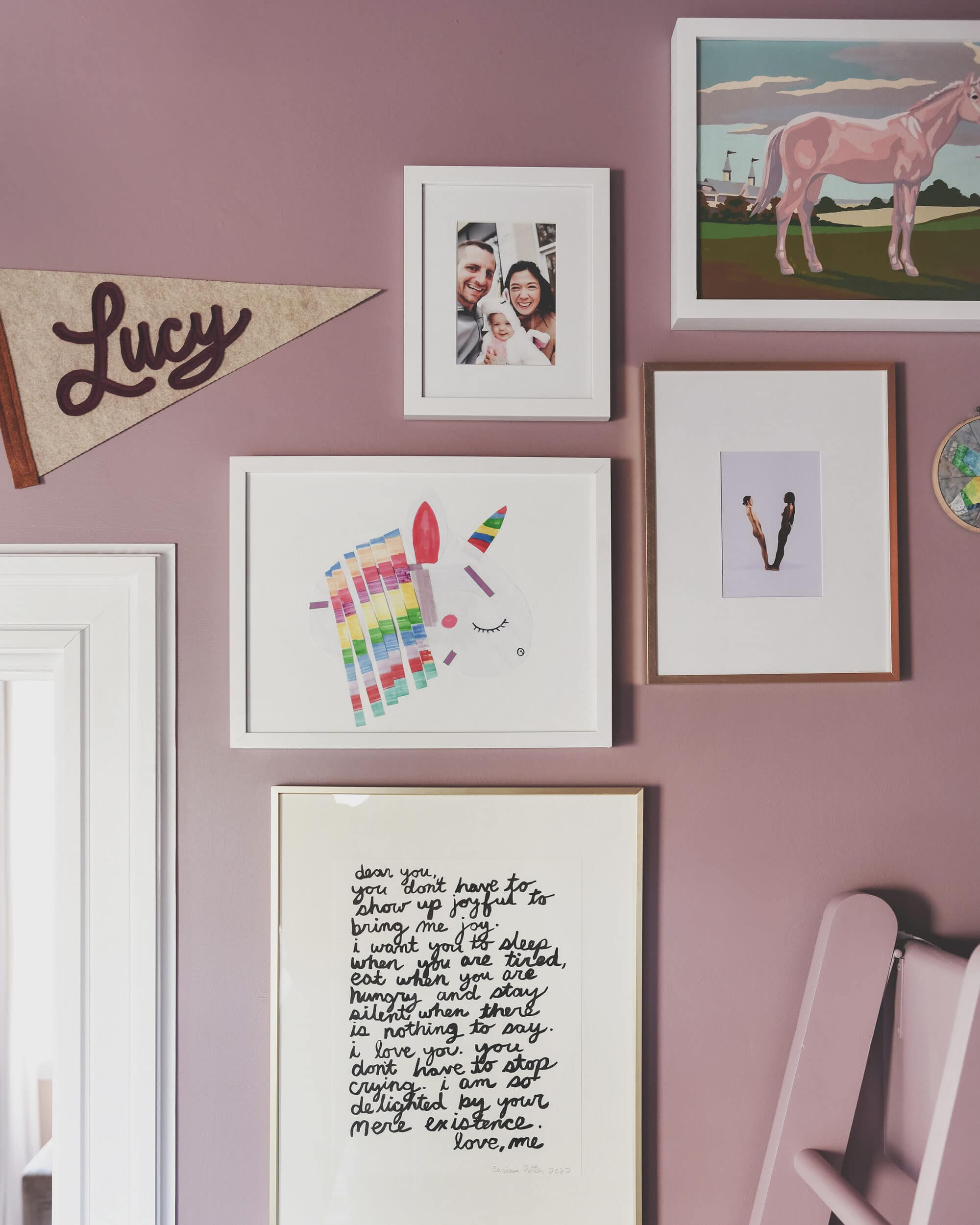 Detail of gallery wall in purple bedroom | purple and unicorn bedroom for a big kid via Yellow Brick Home