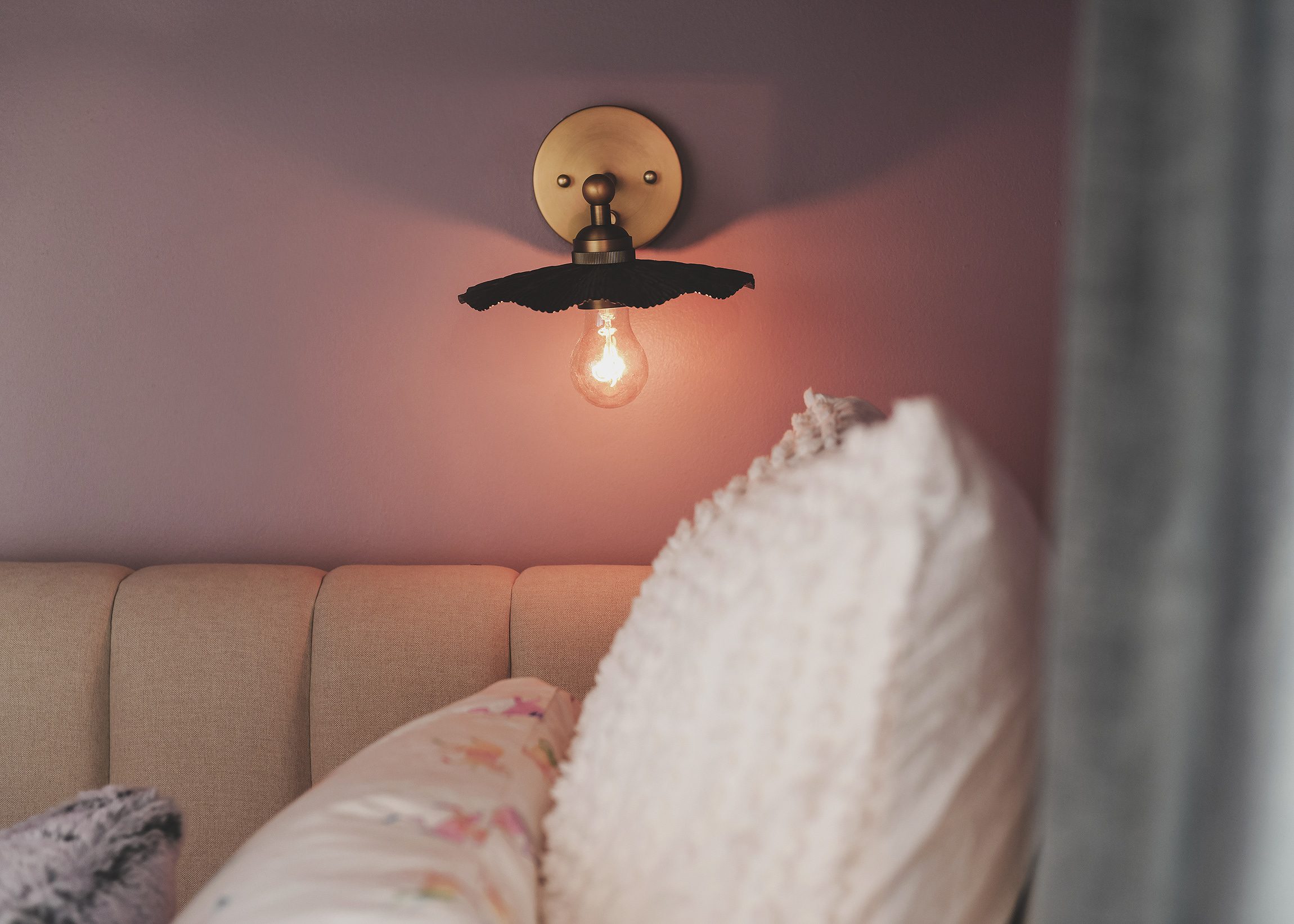 Sconce detail | purple and unicorn bedroom for a big kid via Yellow Brick Home