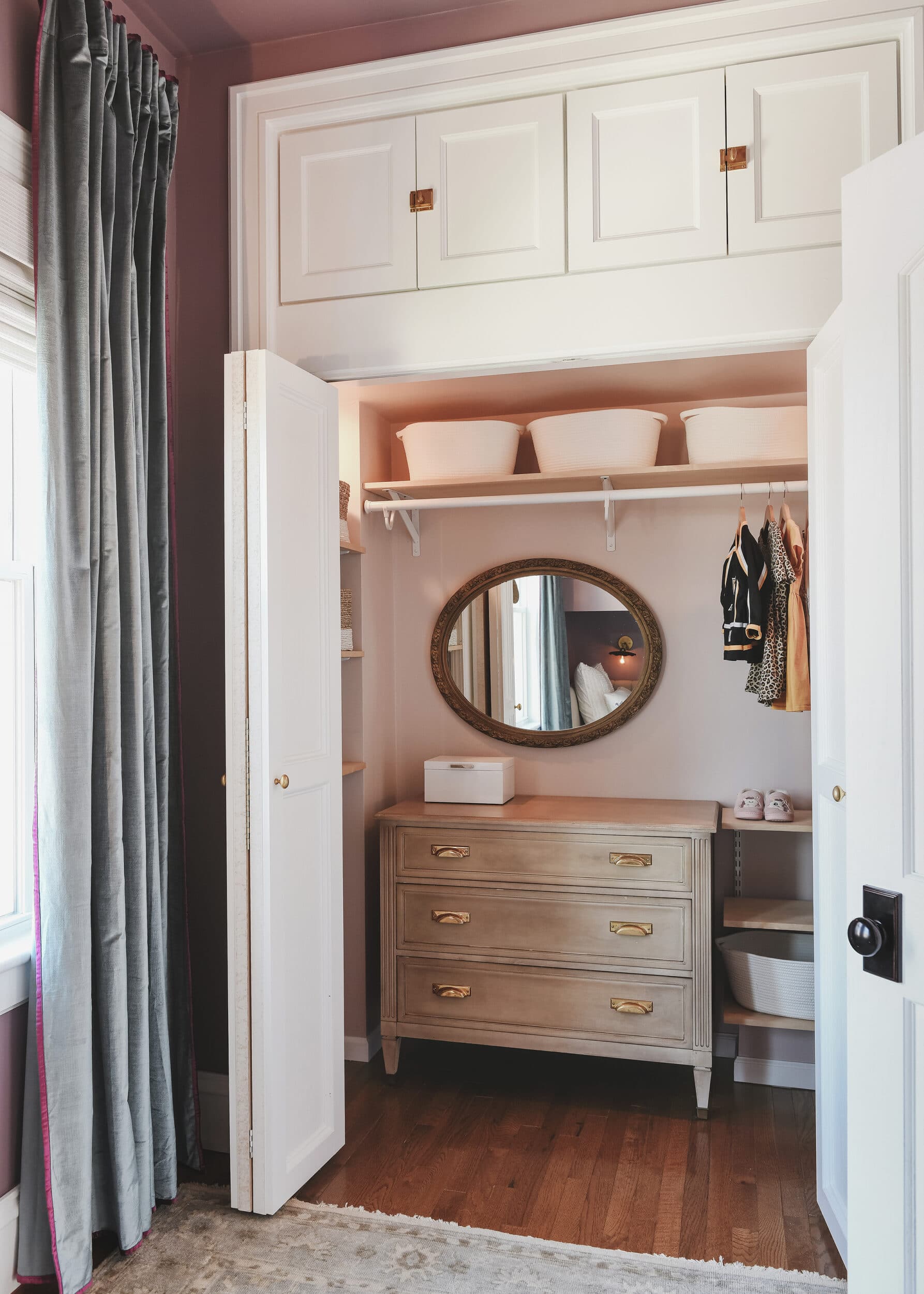 Pink bedroom closet with dresser inside | purple and unicorn bedroom for a big kid via Yellow Brick Home