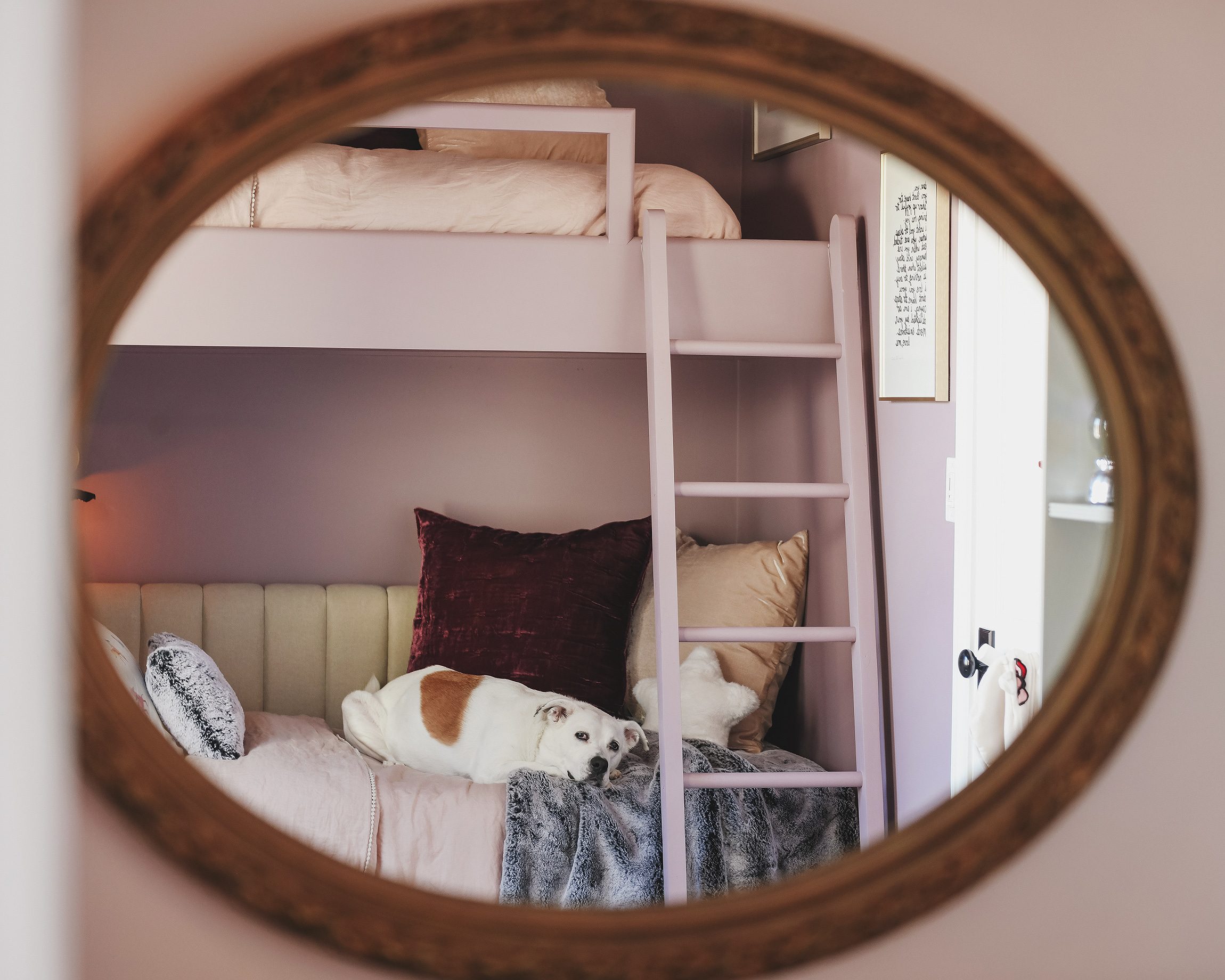 View of room through closet mirror | purple and unicorn bedroom for a big kid via Yellow Brick Home
