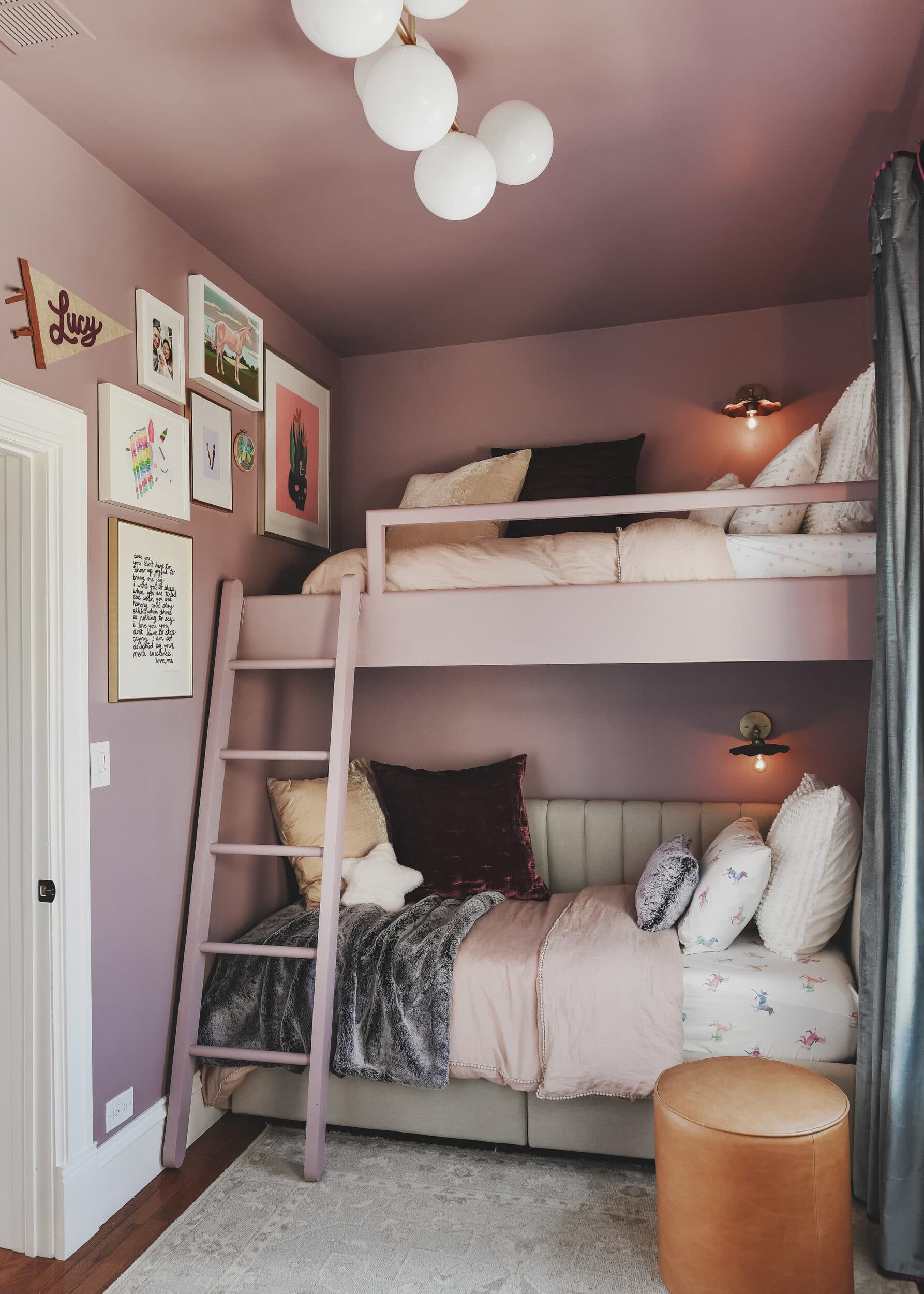 loft bed with bunk below, gallery wall connecting it all | purple and unicorn bedroom for a big kid via Yellow Brick Home