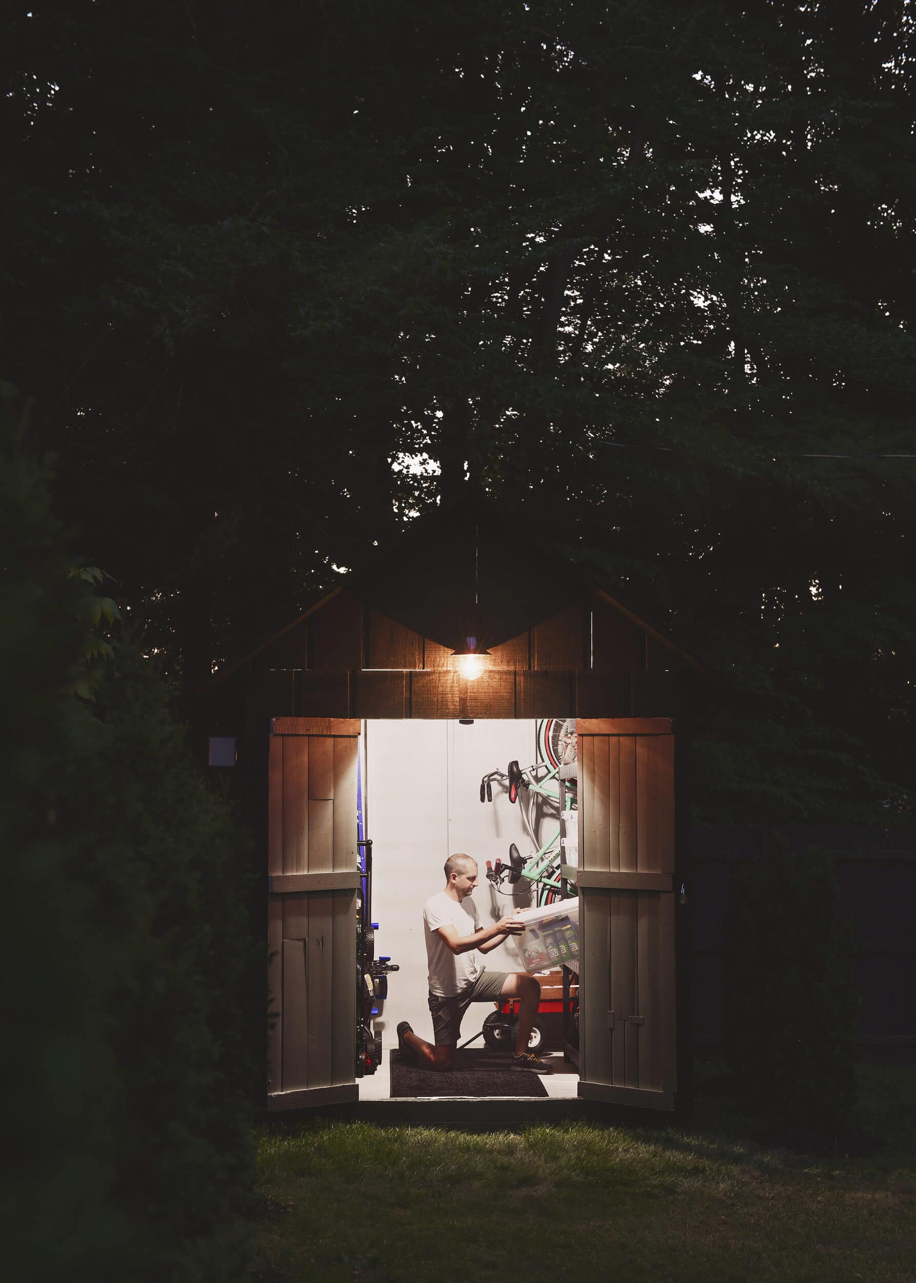 Scott working in the shed in the evening, lit by a solar light! | via Yellow Brick Home