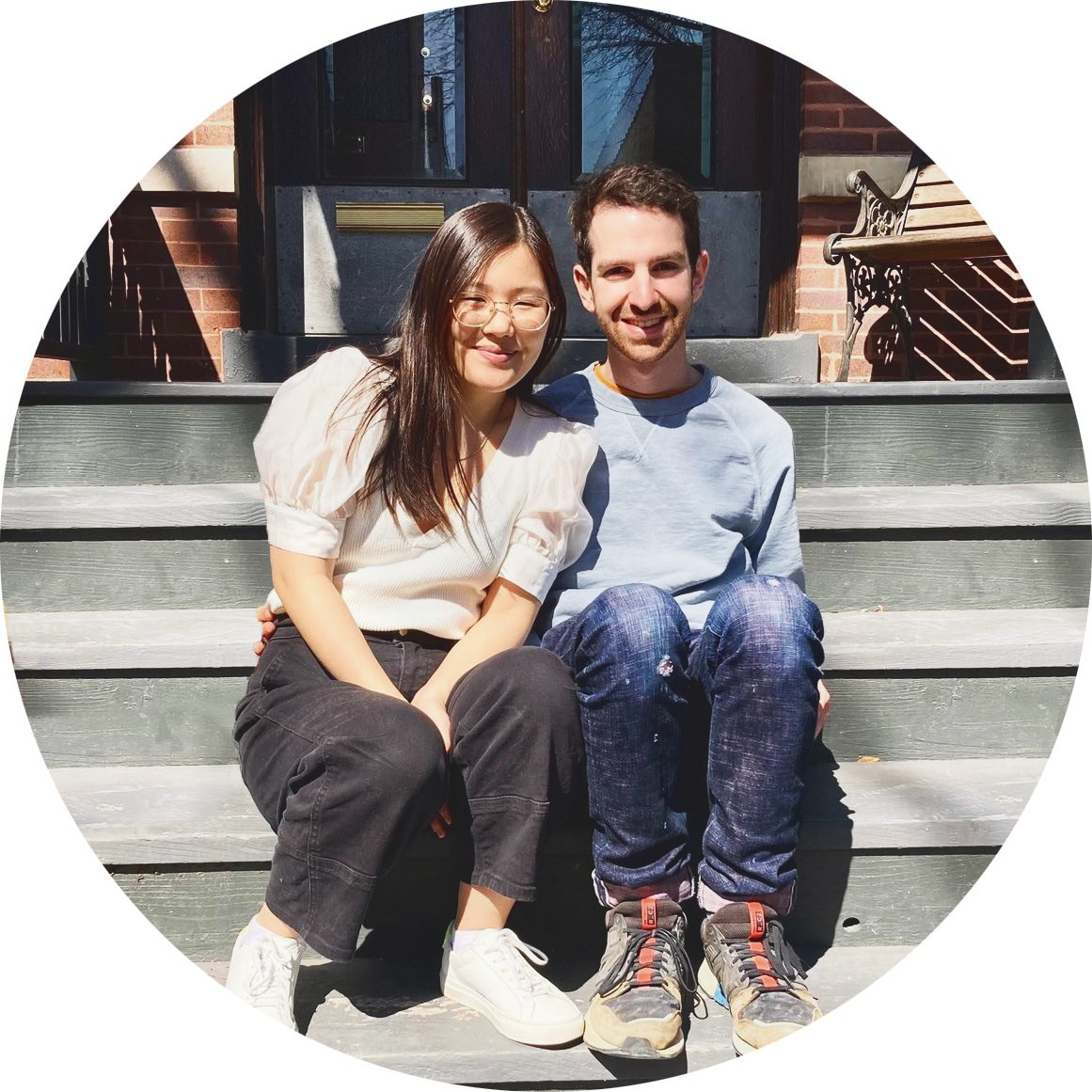 Emily and Corey on the front stairs of their Two Flat | What Is 'Home Hacking'? via Yellow Brick Home