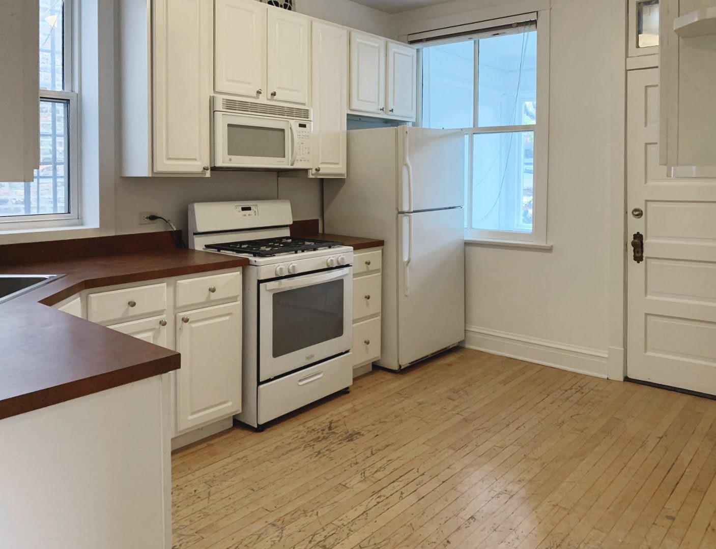 Before view of a kitchen in a Chicago Two Flat | What Is 'Home Hacking'? via Yellow Brick Home
