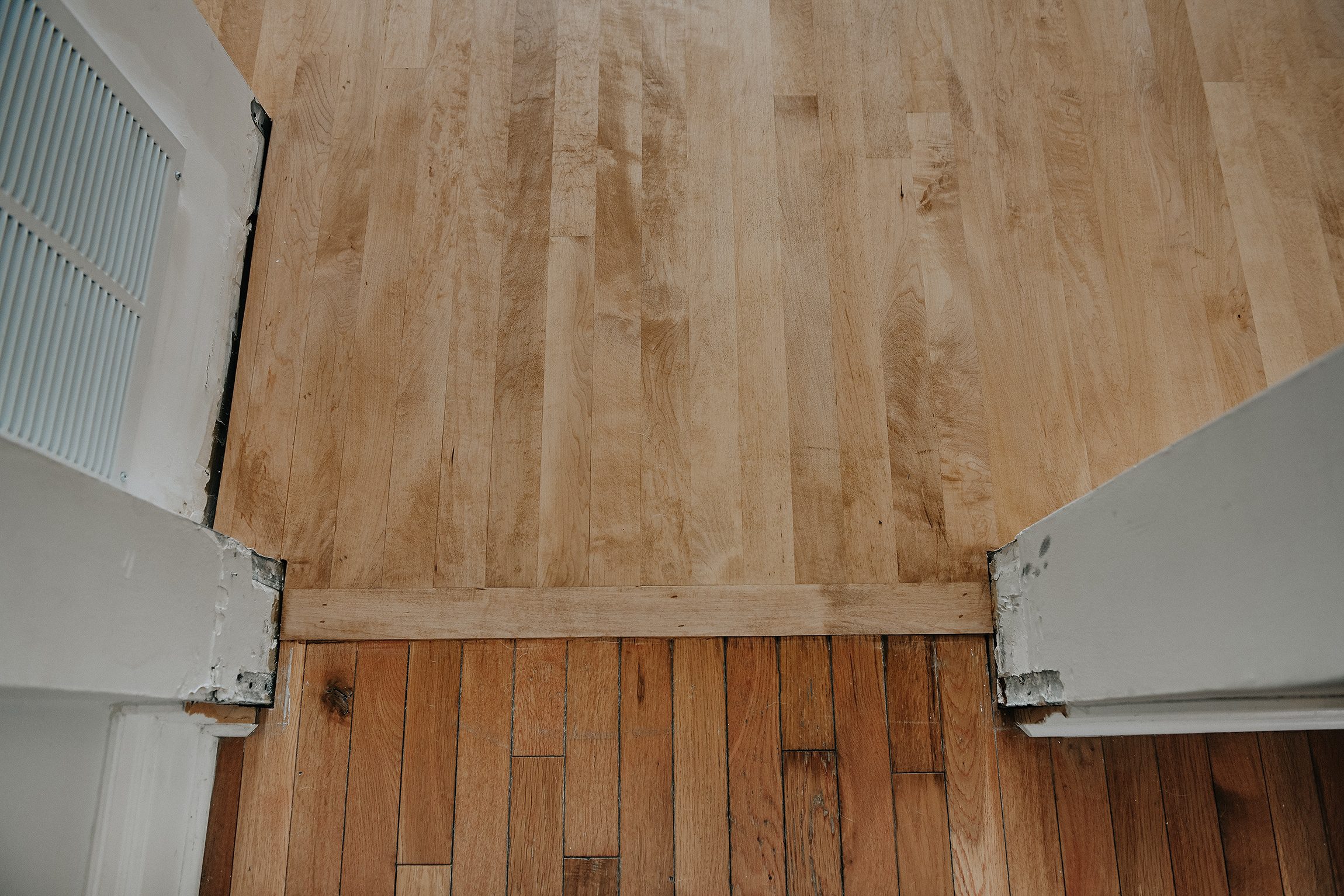 Maple flooring transition between rooms | via Yellow Brick Home