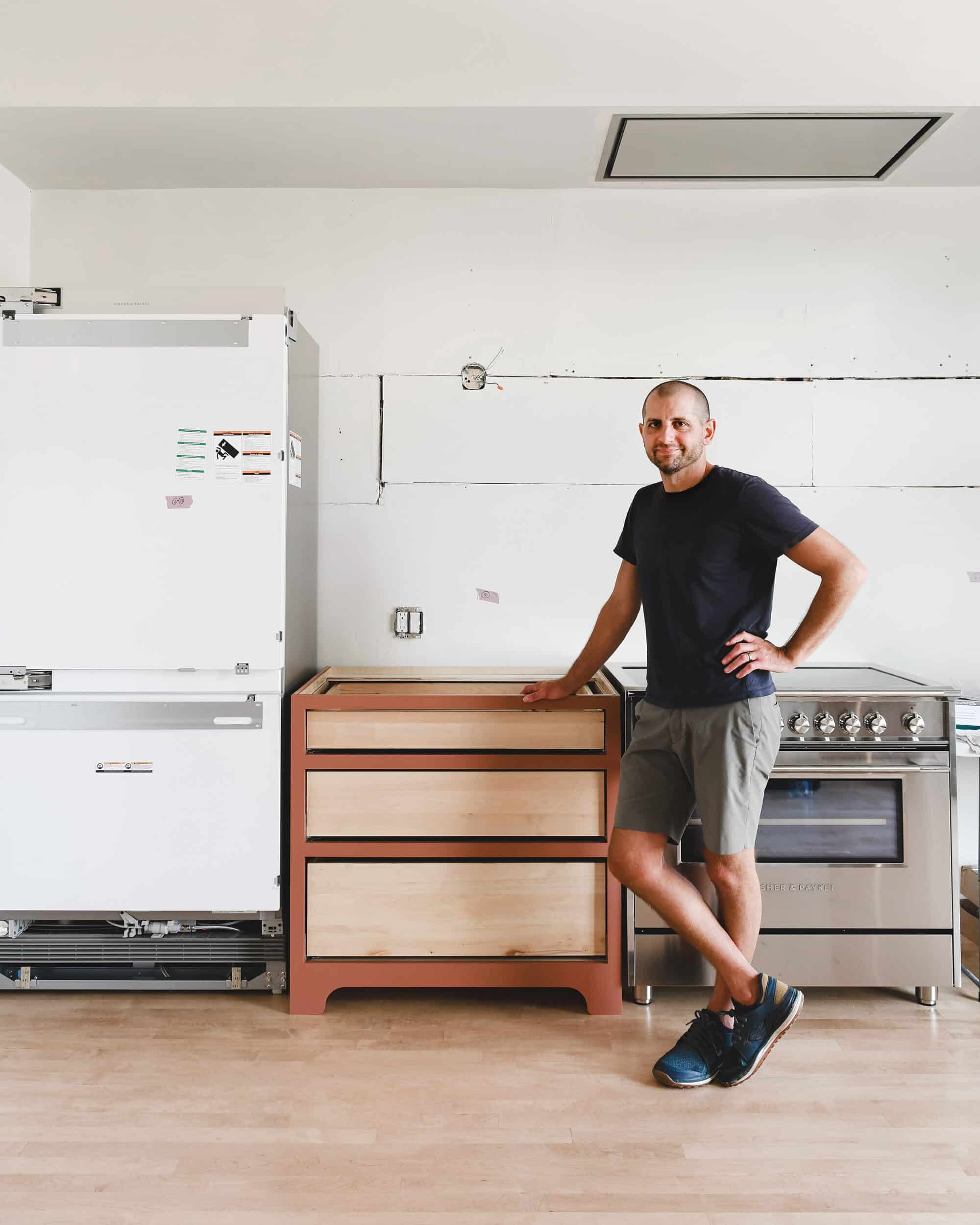 Scott next to our first cabinet build using Cabinet Joint cabinetry // via Yellow Brick Home