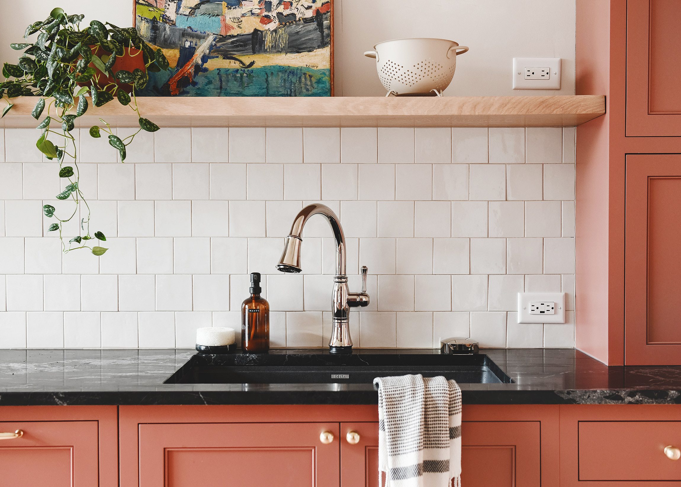 The Delta sink, faucet and glass rinser installed in our new kitchen // via Yellow Brick Home