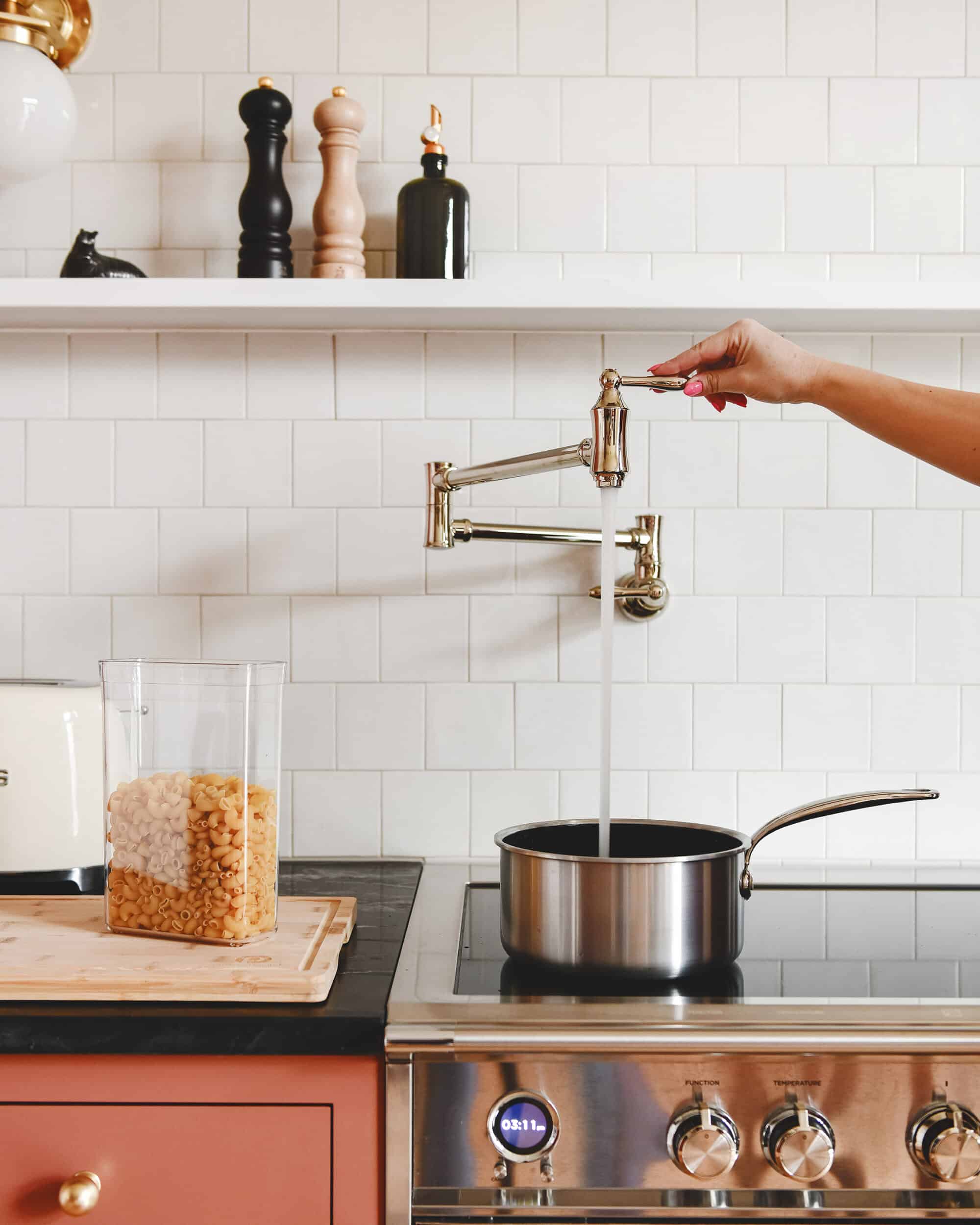 The delta traditional wall mount pot filler above our new range // via Yellow Brick Home