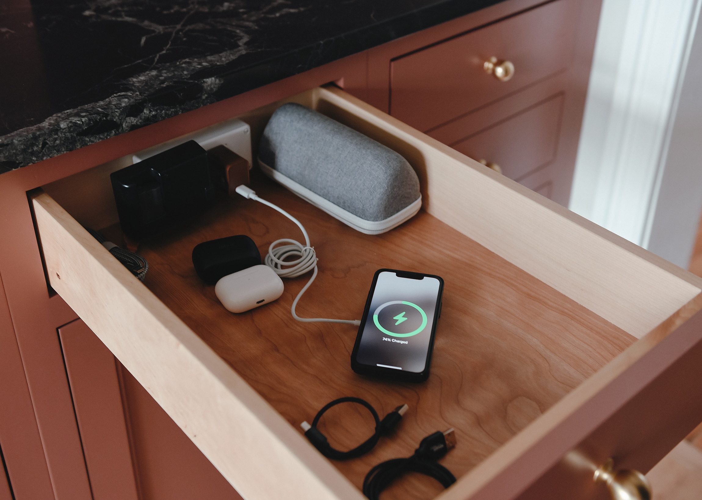 The charging drawer in our newly renovated kitchen // via yellow brick home