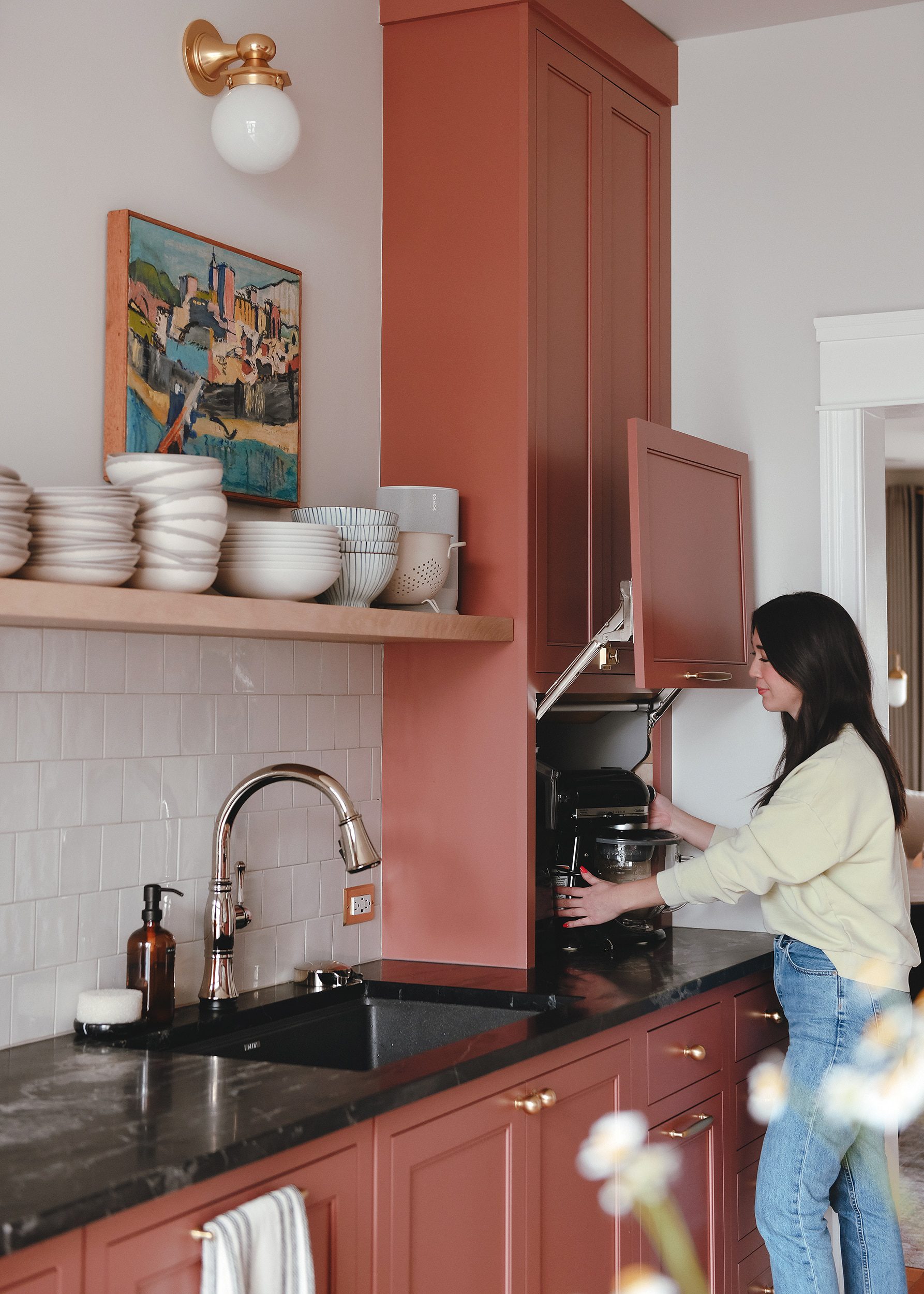 Kim removes our stand mixer from the appliance garage in our newly renovated kitchen // via yellow brick home