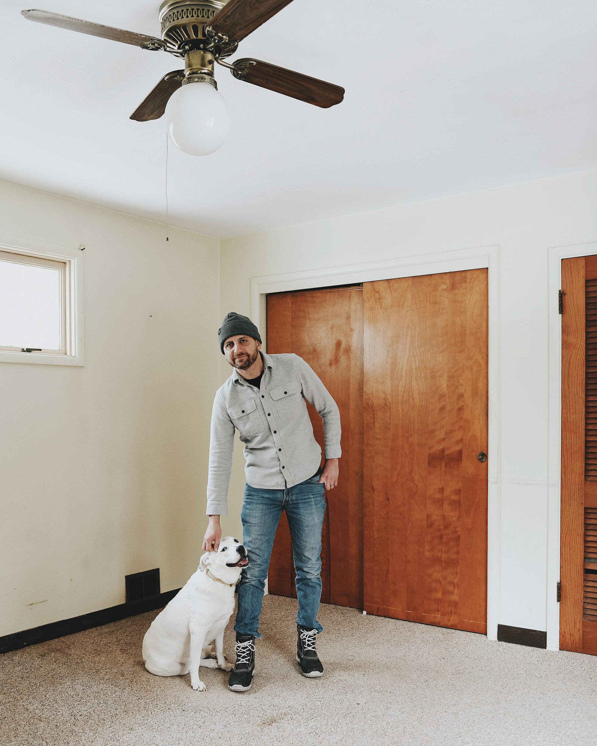 Scott and Catfish in the second bedroom of the Red House on closing day // via Yellow Brick Home