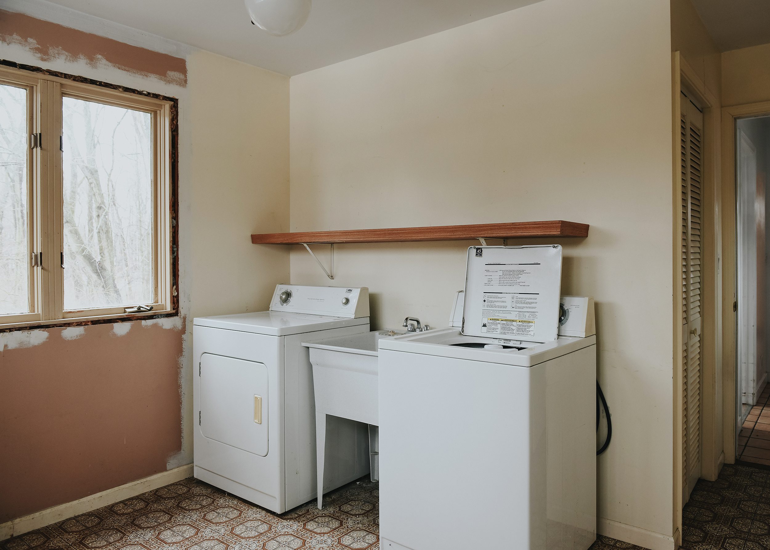 The Red House's current laundry room/future second bedroom // via Yellow Brick Home