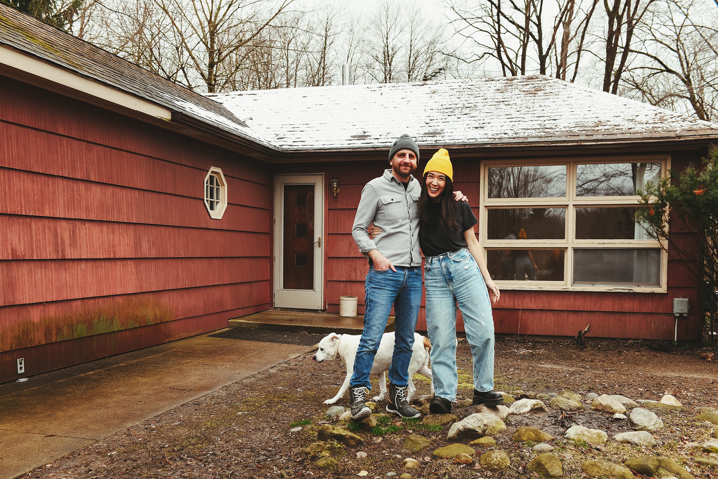 Kim and Scott in front of the 'Red House' mid-century ranch // via Yellow Brick Home
