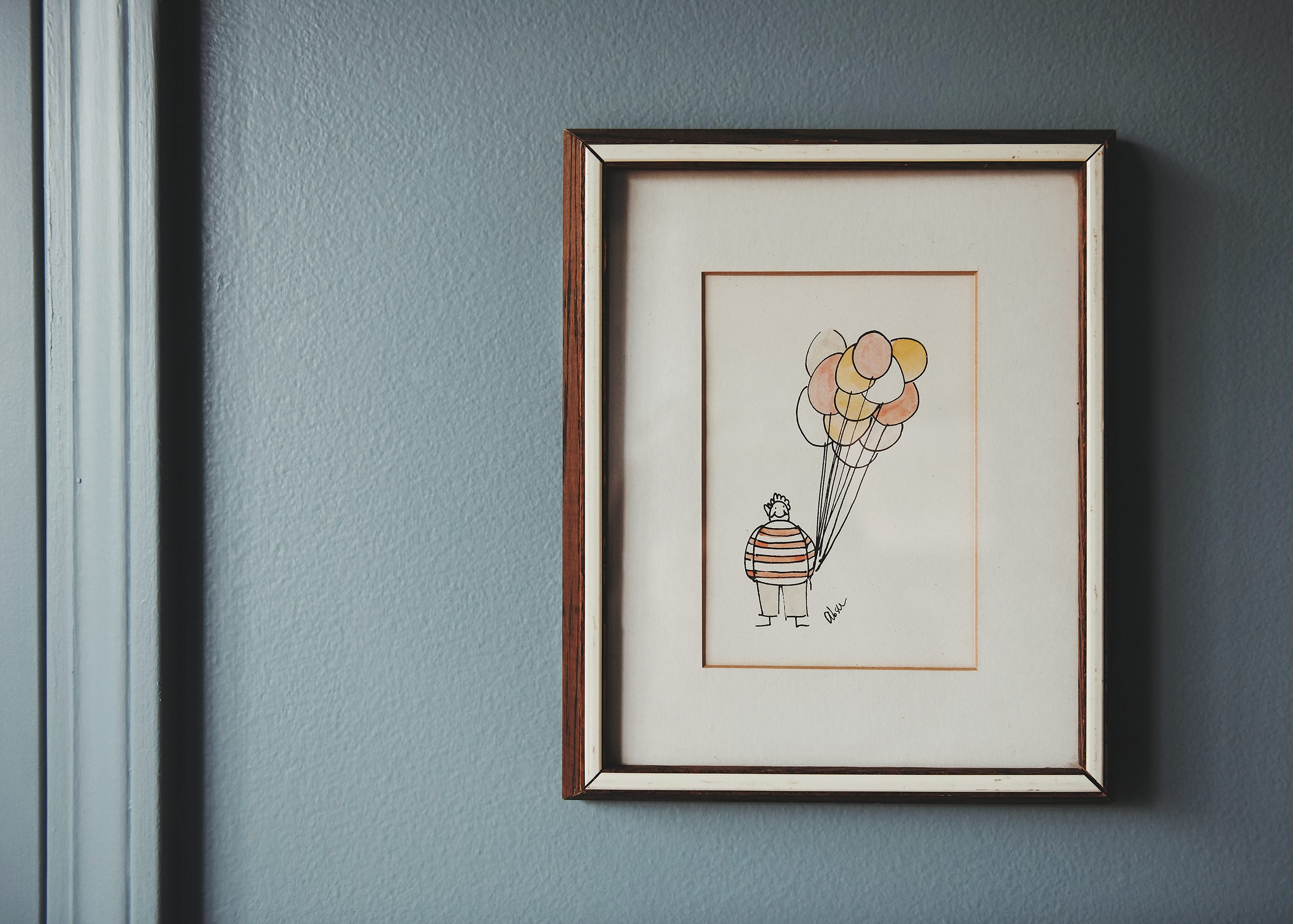 This vintage balloon art was sourced from elsewhere in the building // via Yellow Brick Home