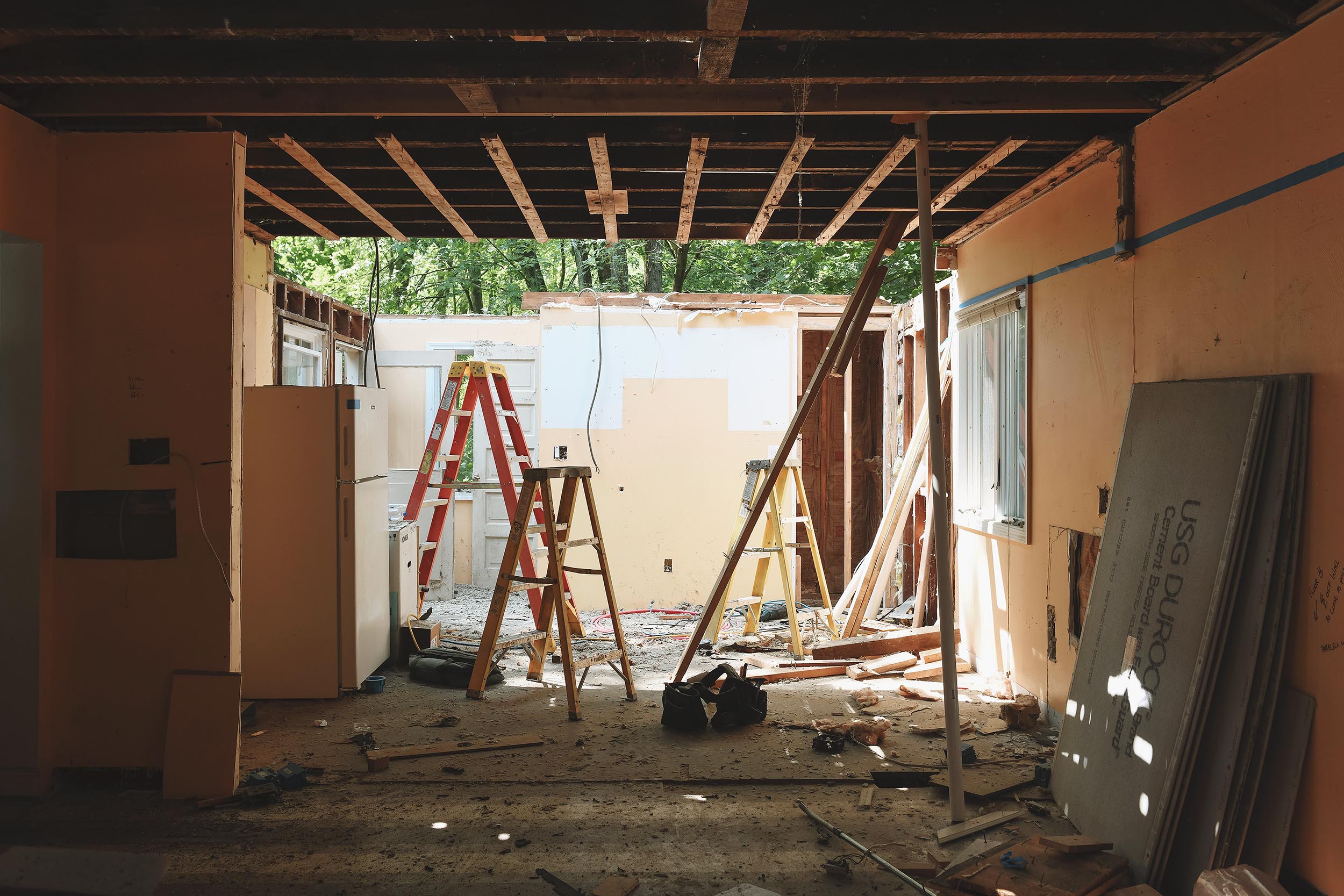 View of the kitchen while the roof is torn off! | via Yellow Brick Home