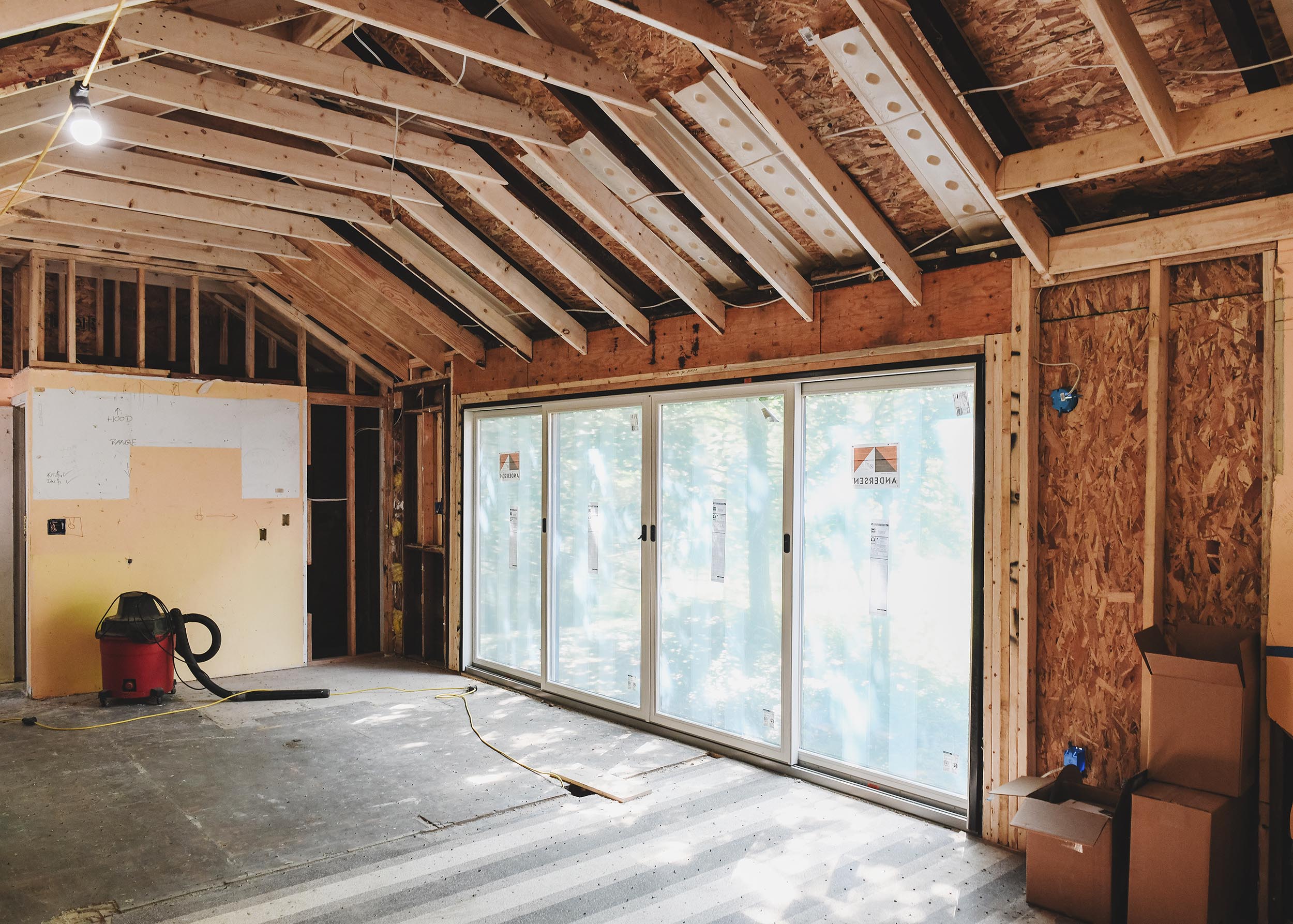 Mid-construction view of the large sliding door that leads to future deck | via Yellow Brick Home