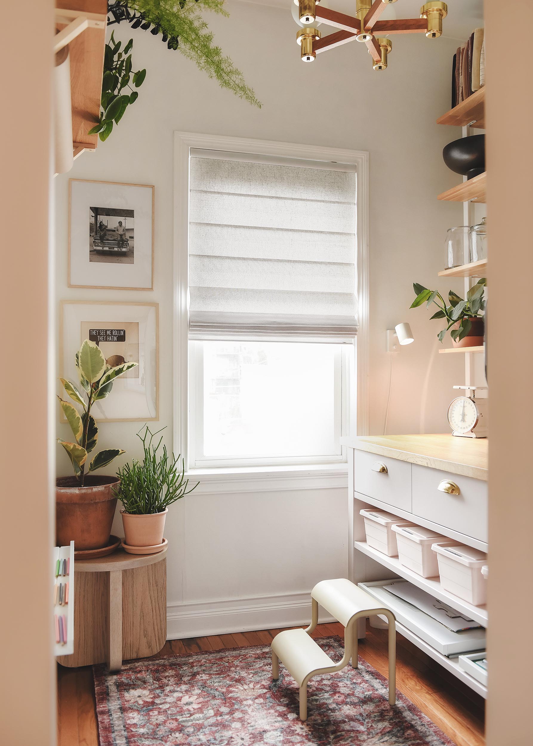 The almost sheer Classic Roman shades in our Chicago craft room offer privacy and light control // via Yellow Brick Home