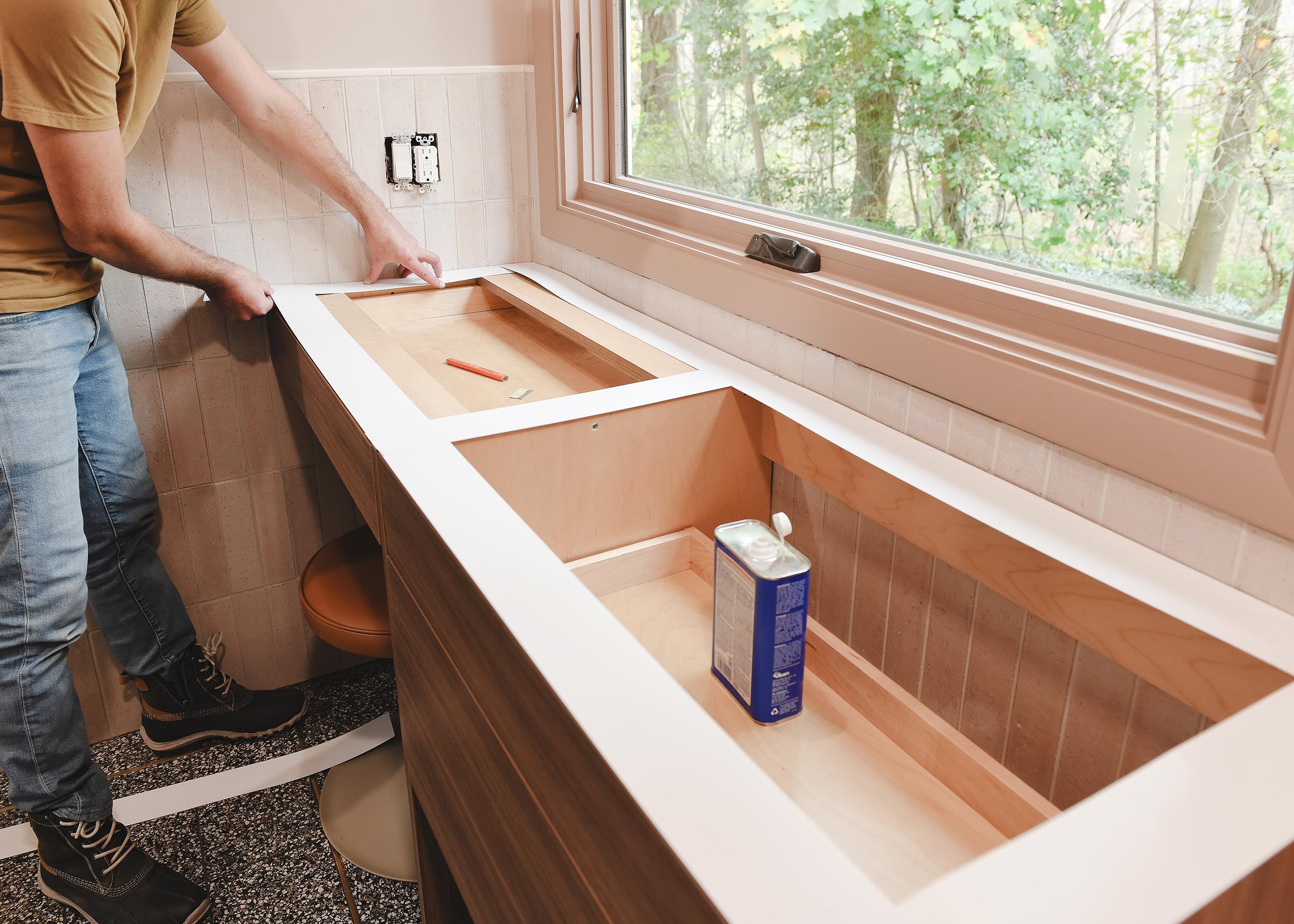 Scott make a countertop template for the vanity in the big bathroom at the Red House // via Yellow Brick Home
