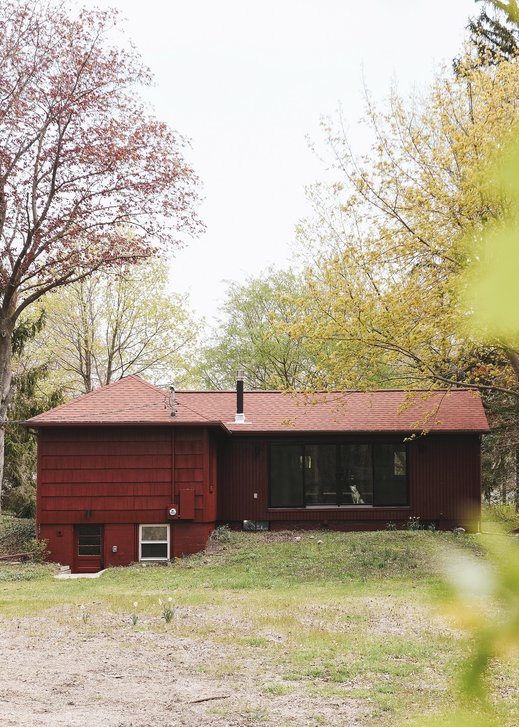 The Red House viewed from the back yard field // via Yellow Brick Home