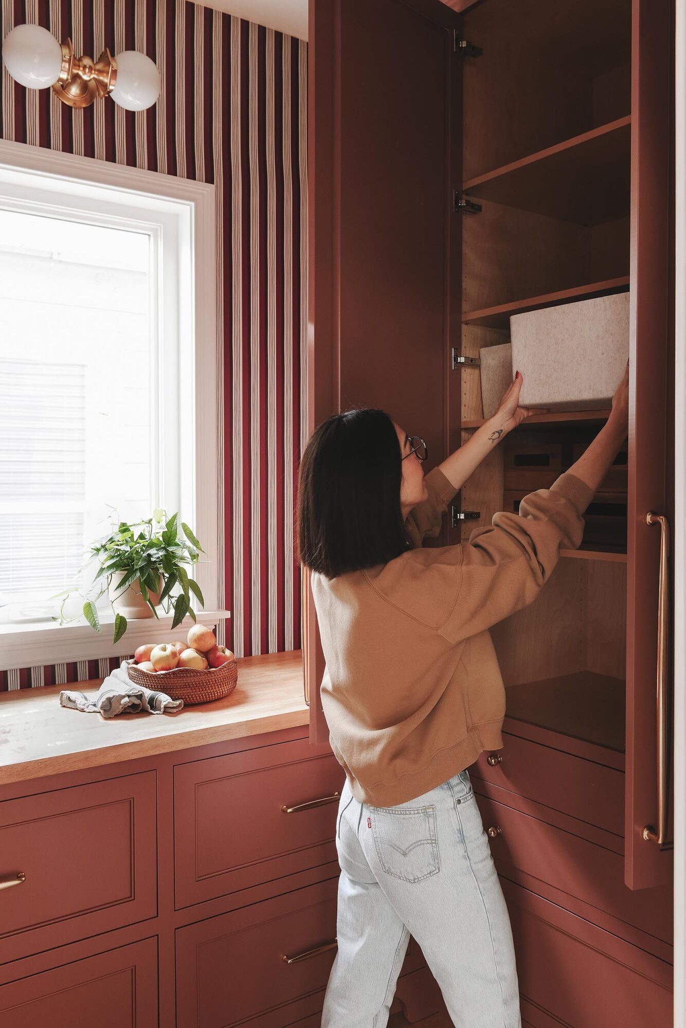 Kim pulls organization tools from our custom pantry cabinets // via Yellow Brick Home