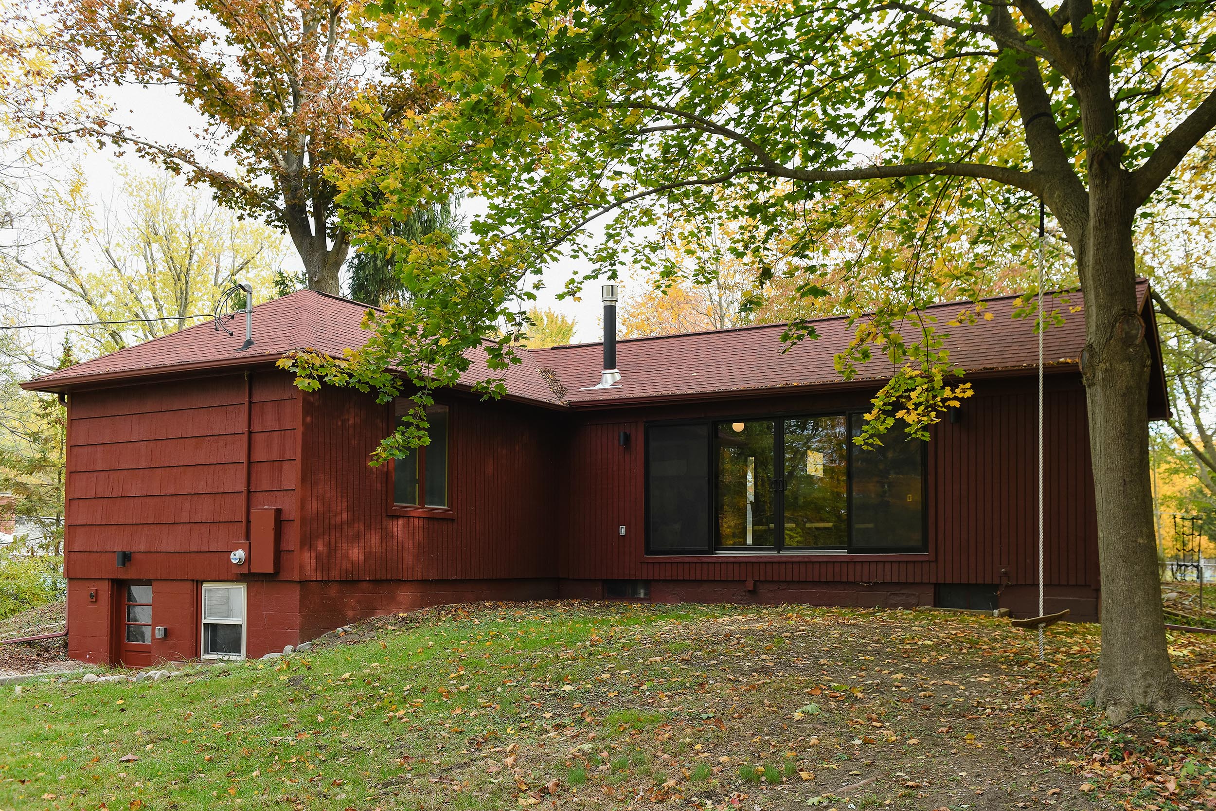 The back of our Michigan Red house before completed TimberTech deck // via Yellow Brick home