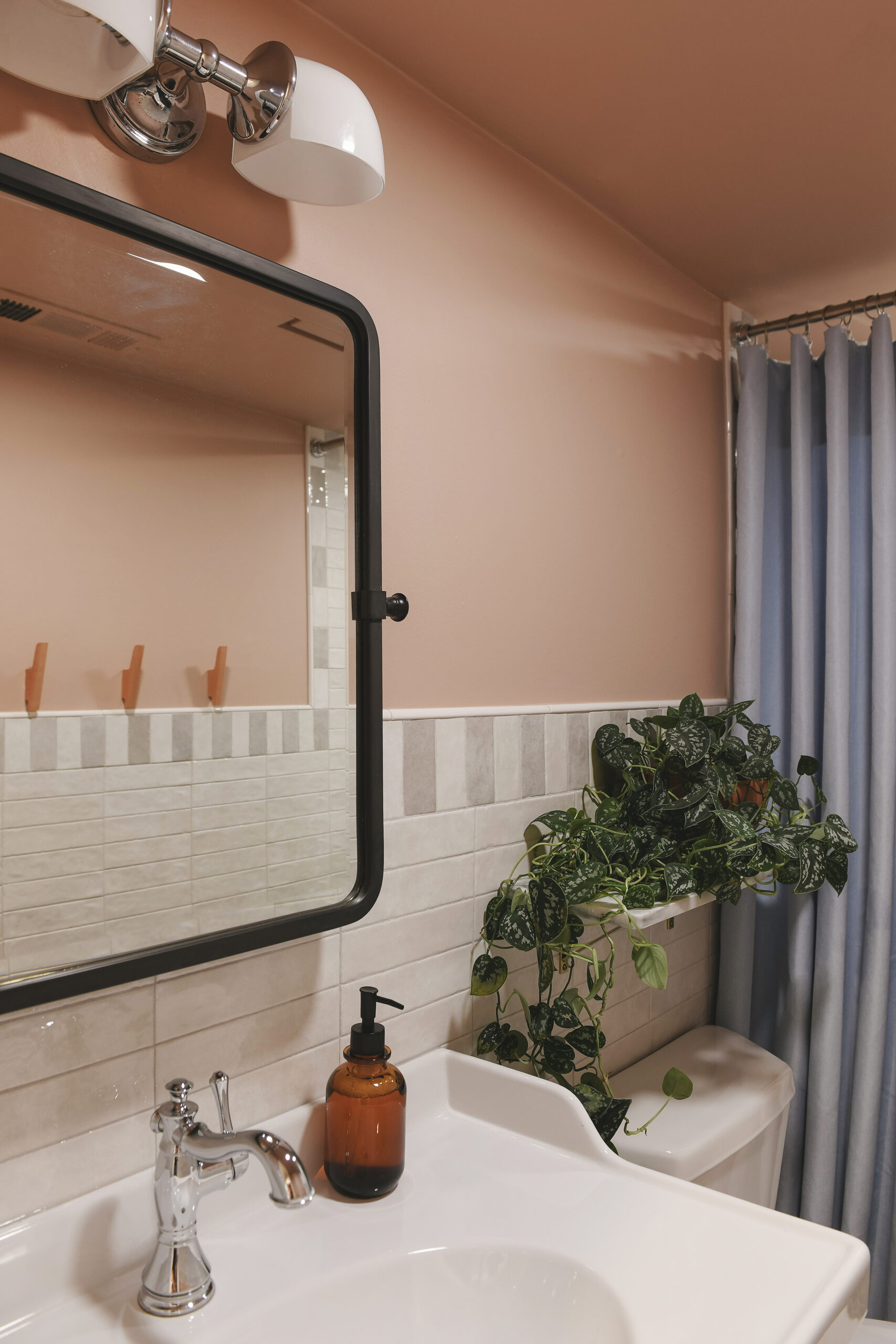 The completed bathroom with additional lighting, a raised ceiling, fresh tile and a whole lot of color // via Yellow Brick Home
