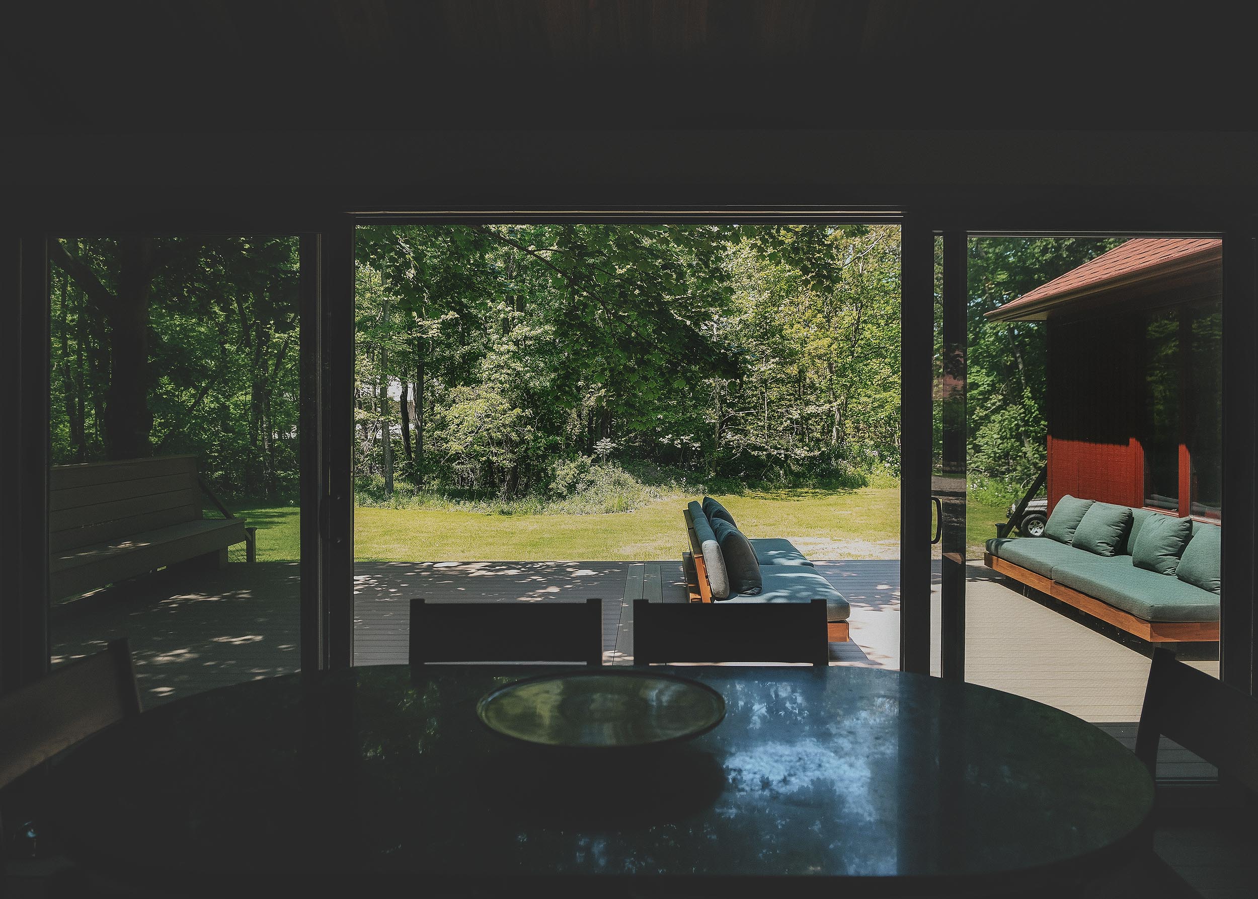 The completed TimberTech deck from inside the kitchen of our Michigan Red House // via Yellow Brick home